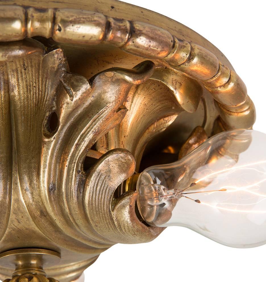 Exposed bulbs were widely popular lighting choices during the 1910s and 1920s and so was a free exploration of Classical Revival motifs. That style teamed for a high-end, yet traditional look, which was well-suited for the countless houses built