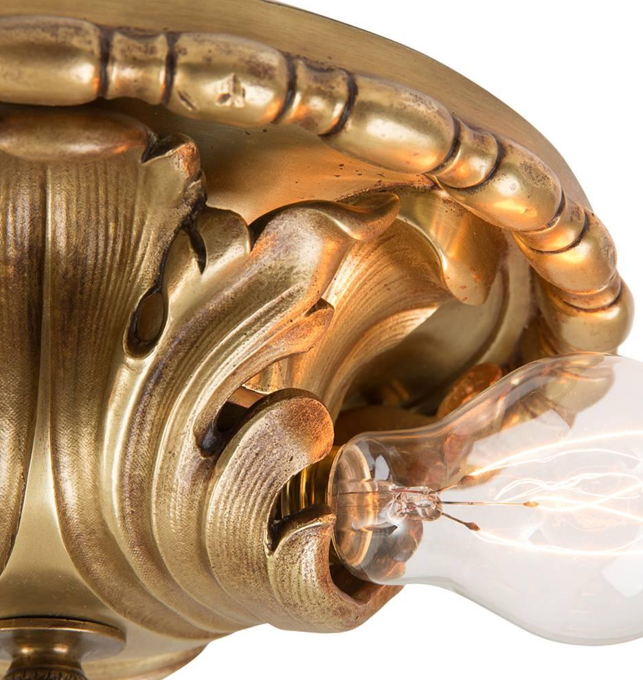 Exposed bulbs were widely popular lighting choices during the 1910s and 1920s, and so was a free exploration of Classical Revival motifs. That style teamed for a high-end, yet traditional look, which was well-suited for the countless houses built