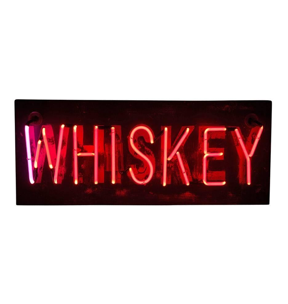 With this neon Whiskey sign its 5 o'clock everywhere. Worn and rusted, we love this reclaimed neon sign almost as much as what its advertising. Perfect for a bar or restaurant (really, anywhere), this Mid-Century sign boasts a hand-painted white and