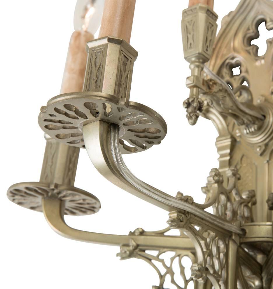 Early 20th Century Pair of Gargoyle-Laden Gothic Revival Nickel-Plated Sconces, circa 1910s For Sale