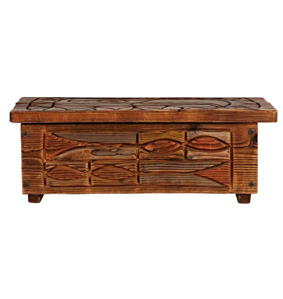 Carved by hand and painted with multicolored milk paint, blanket chest features northwestern native motifs and steel hinges. Part of a complete bedroom set including this trunk, a pair of side tables, two lamps, and a queen-sized bedframe, all