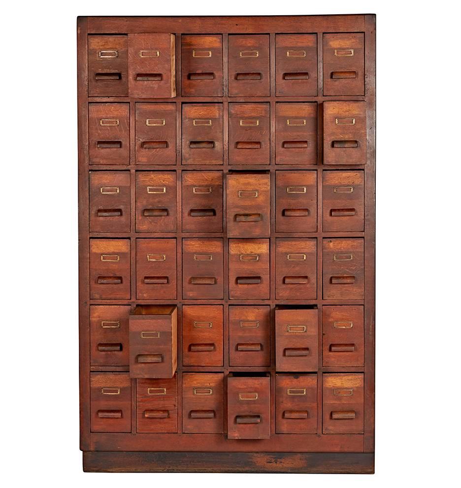 Made from solid and veneered oak, with lovely weathered patina, comprising 36 dovetailed drawers. Likely salvaged from a apothecary or spice shop in the Netherlands (its place of origin), this cabinet would have taken up the entire back counter