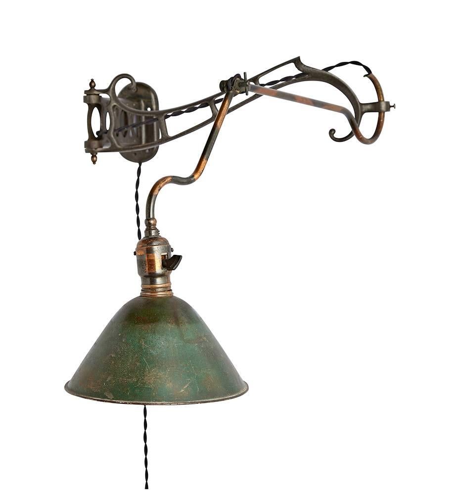 The distinctive adjustable brass fixtures of the Faries Company of Decatur, Ill. have become some of the most sought-after antiques in the Industrial lighting market, and their Model no. 7 is a good reason why. Classic Faries patented joints, the
