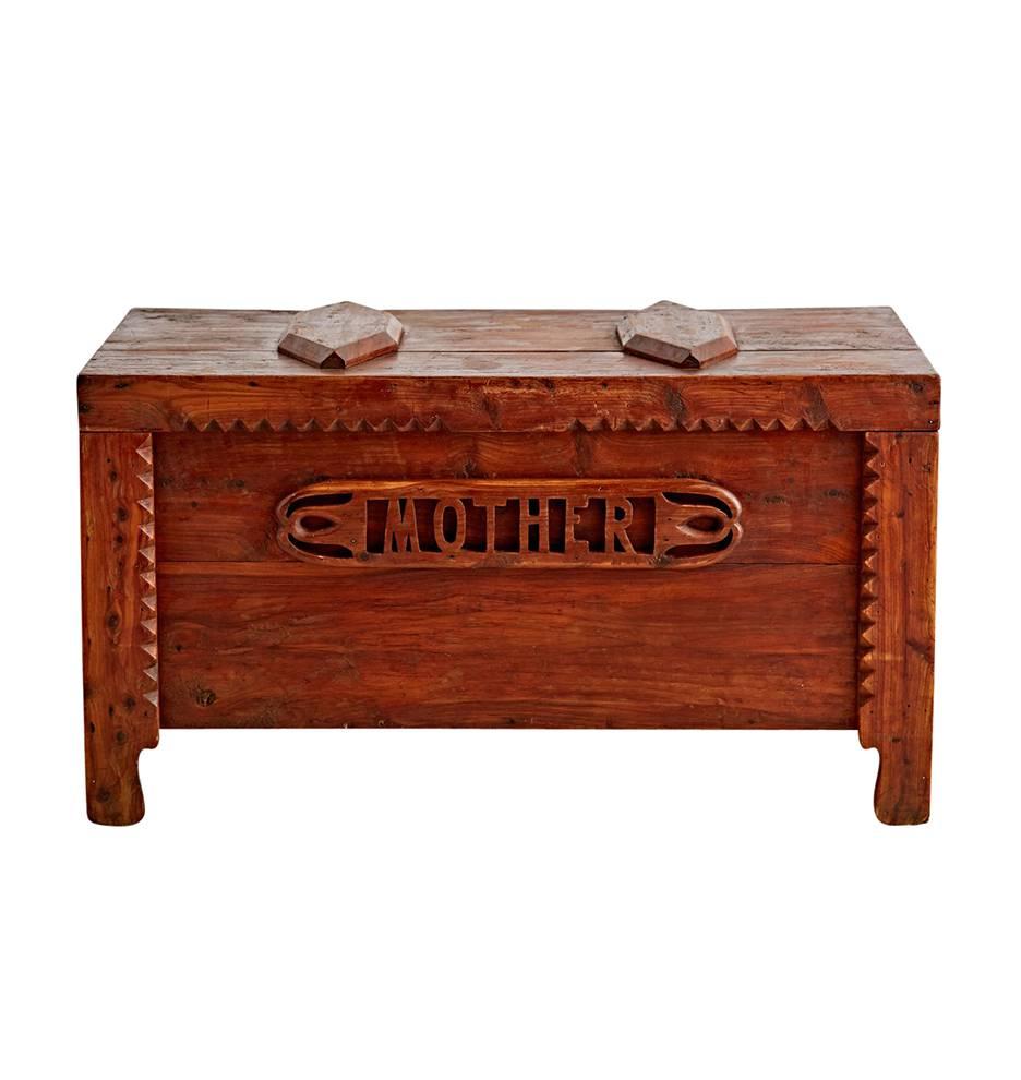 Unlike any other trunk that has ever come through our shop, this hand-built storage piece is made of aromatic cedar and is embellished with a carved MOTHER plaque on the front. A wonderful, good-smelling piece.