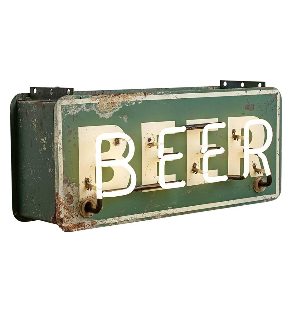 Worn and rusted, we love this reclaimed neon sign almost as much as what it's advertising. Perfect for a bar or restaurant (really, anywhere), this Mid-Century sign boasts a hand-painted green and white composition, with glowing white neon. While