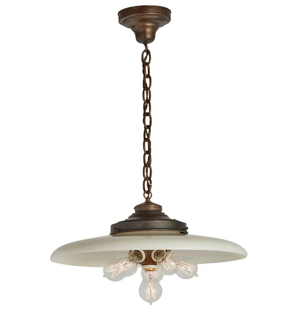 A Classic functional pendant common in countless early 20th century commercial and Industrial settings, and now quite hard to find. To increase the light output of single-socket cord pendants like this, porcelain-insulated cluster sockets by