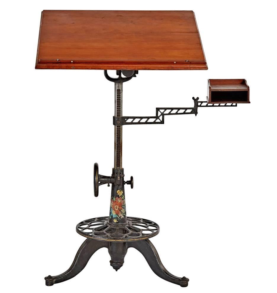 Comprised of cast iron and pine, this iconic drafting table is exemplary of the high-end drafting and surveying products made by the various companies at the turn of the century. This edition offers a complete range of articulation, extending from