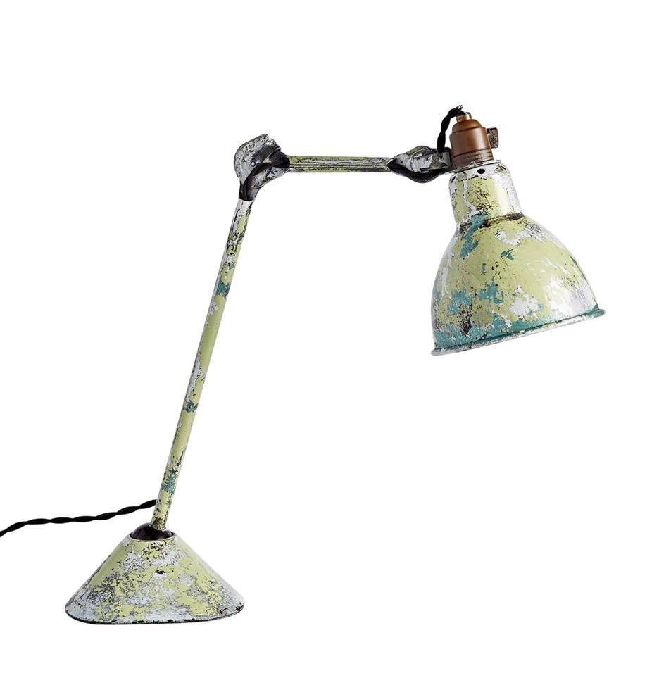 Designed by Frenchman Bernard-Albin Gras, the 205 task lamp is still in manufacture today. This 1930s example was harvested right from the source, found on a trip in France, complete with innumerable layers of wonderfully worn paint. 

Comes