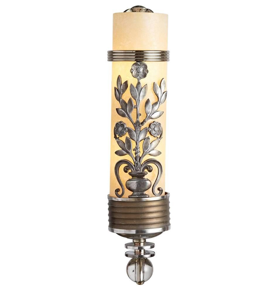 Rescued from a 1930s Art Deco theater (the likes of which would have made Rockefeller Plaza green with envy, no doubt), come these remarkable large-scale sconces. Comprised of a cylinder of textured glass, encased in bands of fluted aluminum,