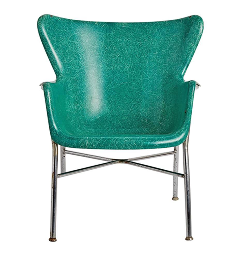 Most likely designed by Lawrence Peabody for Selig (although Luther Canover had a similar product), these remarkable fiberglass chairs are a wingbacked alternative to the Eames edition of fiberglass seating. Cradled in a polished chrome tubular