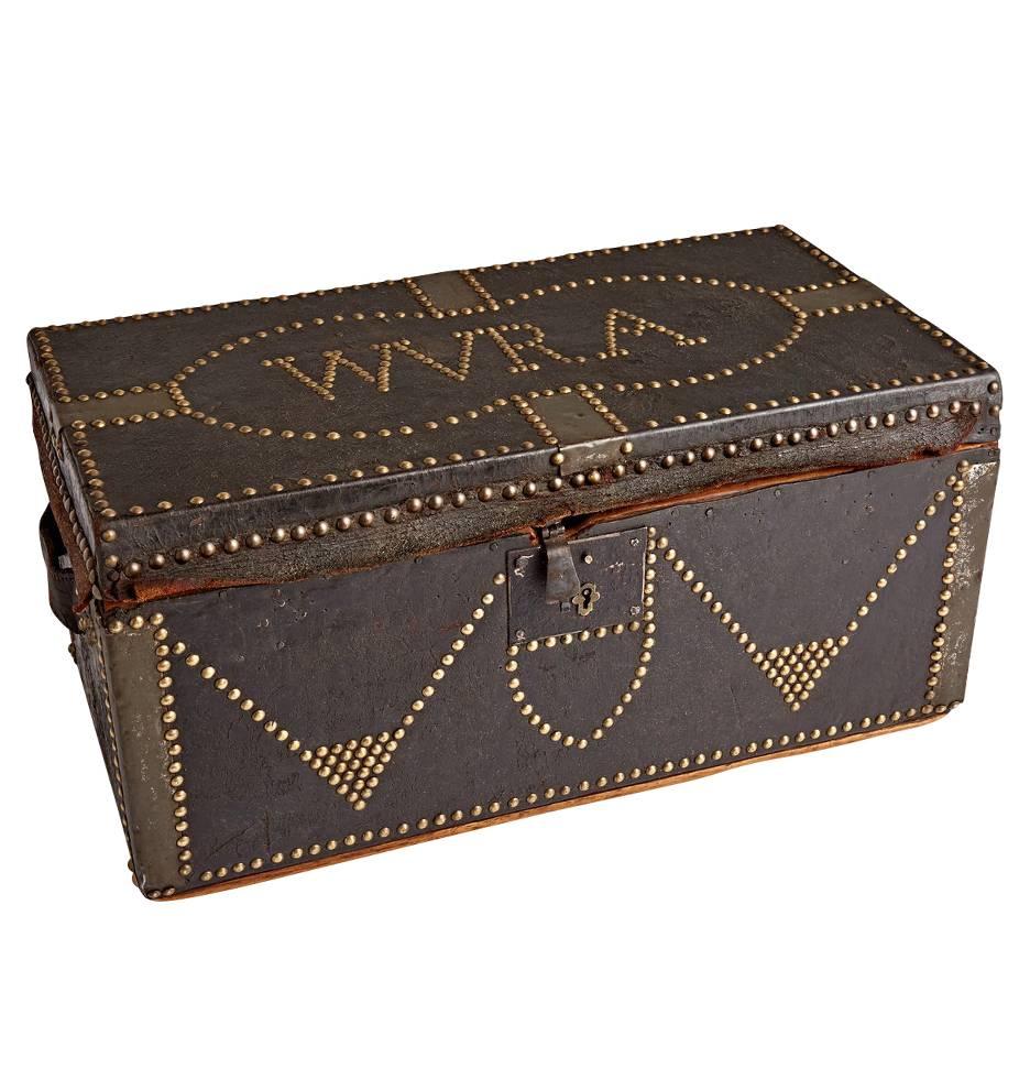 Covered in leather and carefully decorated with legions of nailheads, the creator of this trunk spelled out 