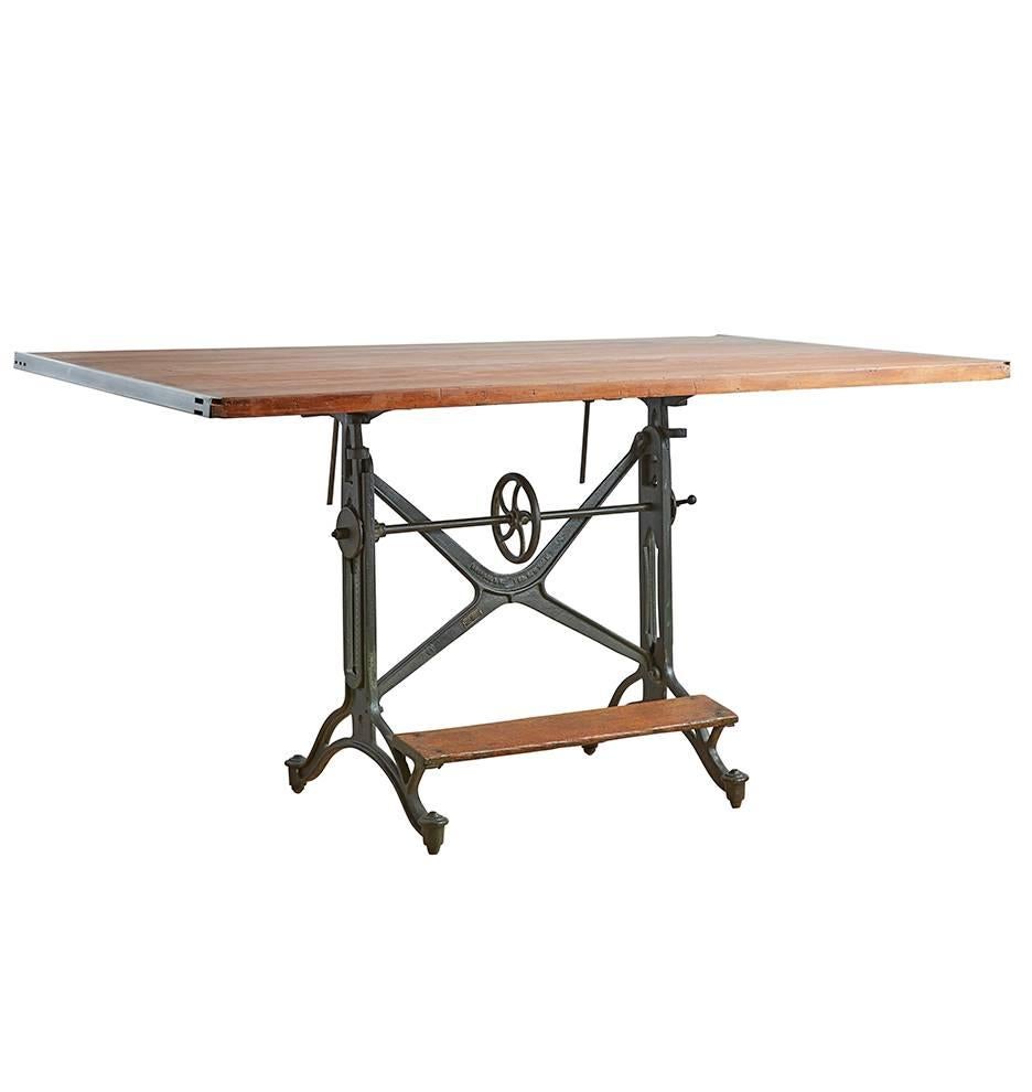 Comprised of cast iron and solid oak, this iconic Keuffel & Esser drafting table is exemplary of the high-end drafting and surveying products made by the New York-based company at the turn of the century. This edition offers a complete range of