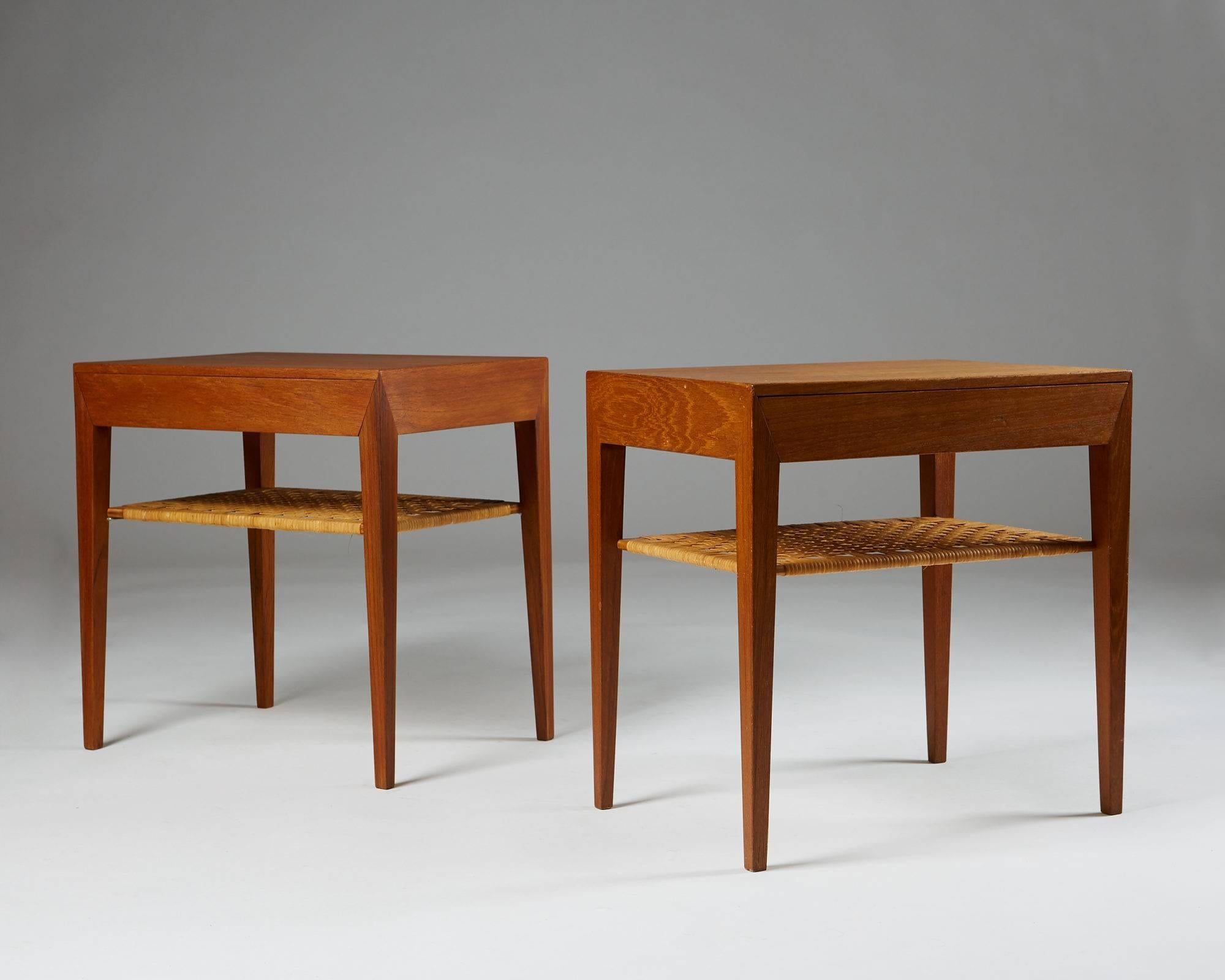 Pair of bedside/lamp tables designed by Severin Hansen for Haslev, 
Denmark, 1950s.
Teak and cane.

H: 50 cm/ 19 3/4''
L: 50 cm/ 19 3/4''
D: 35 cm/ 13 3/4''