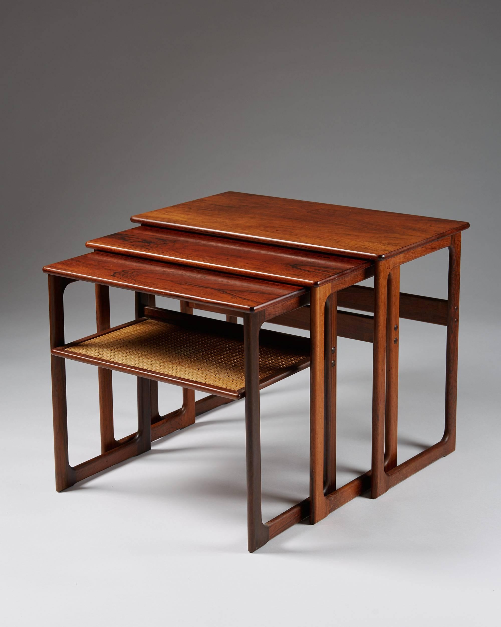 Nest of tables designed by Johannes Andersen for CFC Silkeborg,
Denmark, 1960s.

Rosewood and cane.

Measures: H: 53 cm / 20 3/4''
W: 65 cm / 25 1/2''
D: 37 cm / 14 1/2''