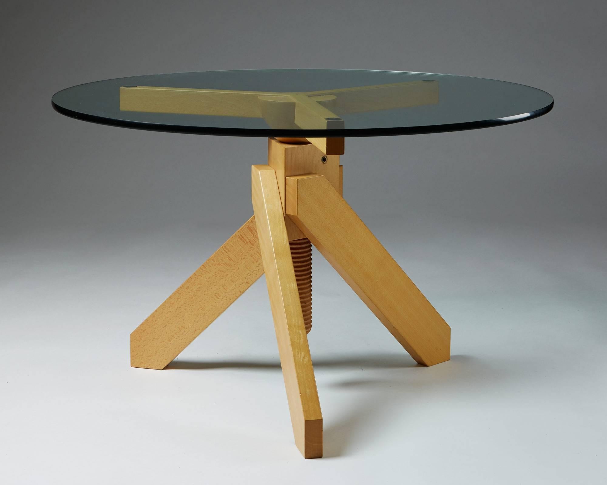 Adjustable table Vidun designed by Vico Magistretti for De Padova, Italy, 1986.
Solid beech and glass.

Measure: Adjustable height from 66 cm/ 26'' to 88 cm/ 34 1/2''
D 110 cm/ 43 1/4''.