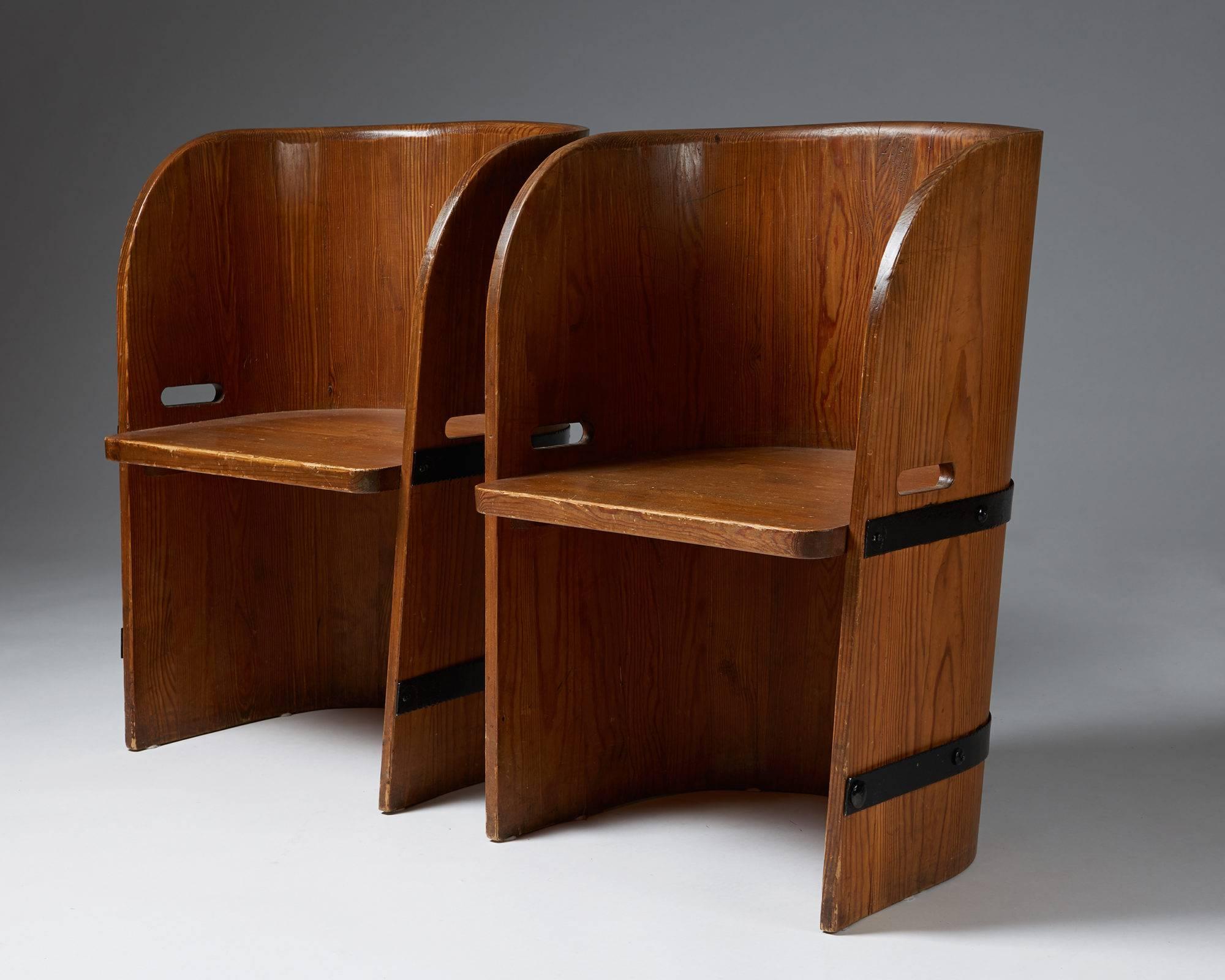 Pair of armchairs anonymous, Sweden, 1940s.
Solid pine and iron.

H: 76 cm/ 30''
W: 54 cm/ 21 1/4''
D: 44 cm/ 17 1/4''
Seat height: 39.5 cm/ 15 1/2''.