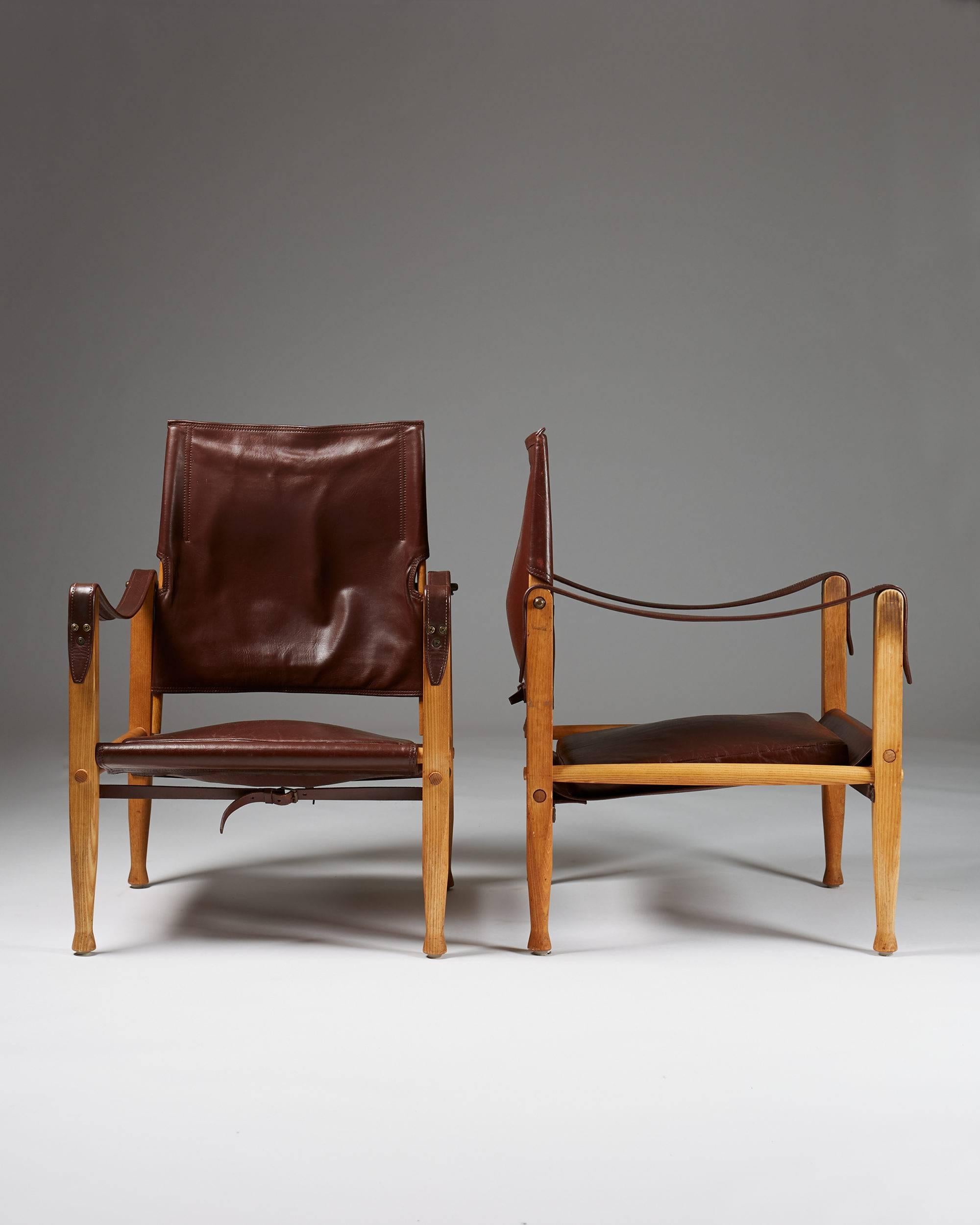Pair of Safari armchairs designed by Kaare Klint, Denmark, 1950s. Ash and original leather.

Measure: H 80 cm/ 31 1/2''
W 56 cm/ 22''
D 56 cm/ 22''.