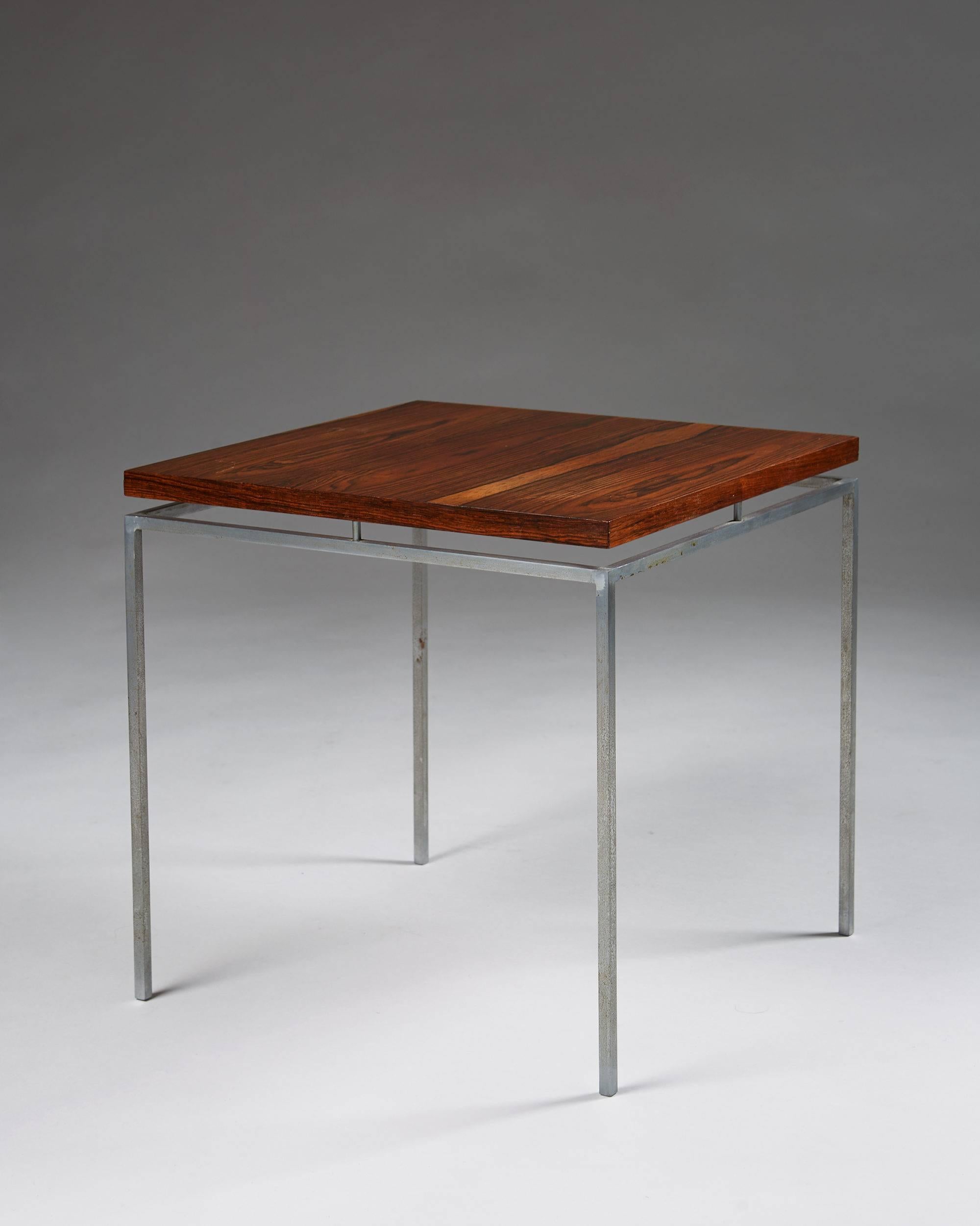 Side table designed by Knud Joos for Jason, Denmark, 1960. Steel and rosewood.

Measures: H: 40 cm/ 15 3/4''
L: 42 cm/ 16 1/2''
D: 42 cm/ 16 1/2''.