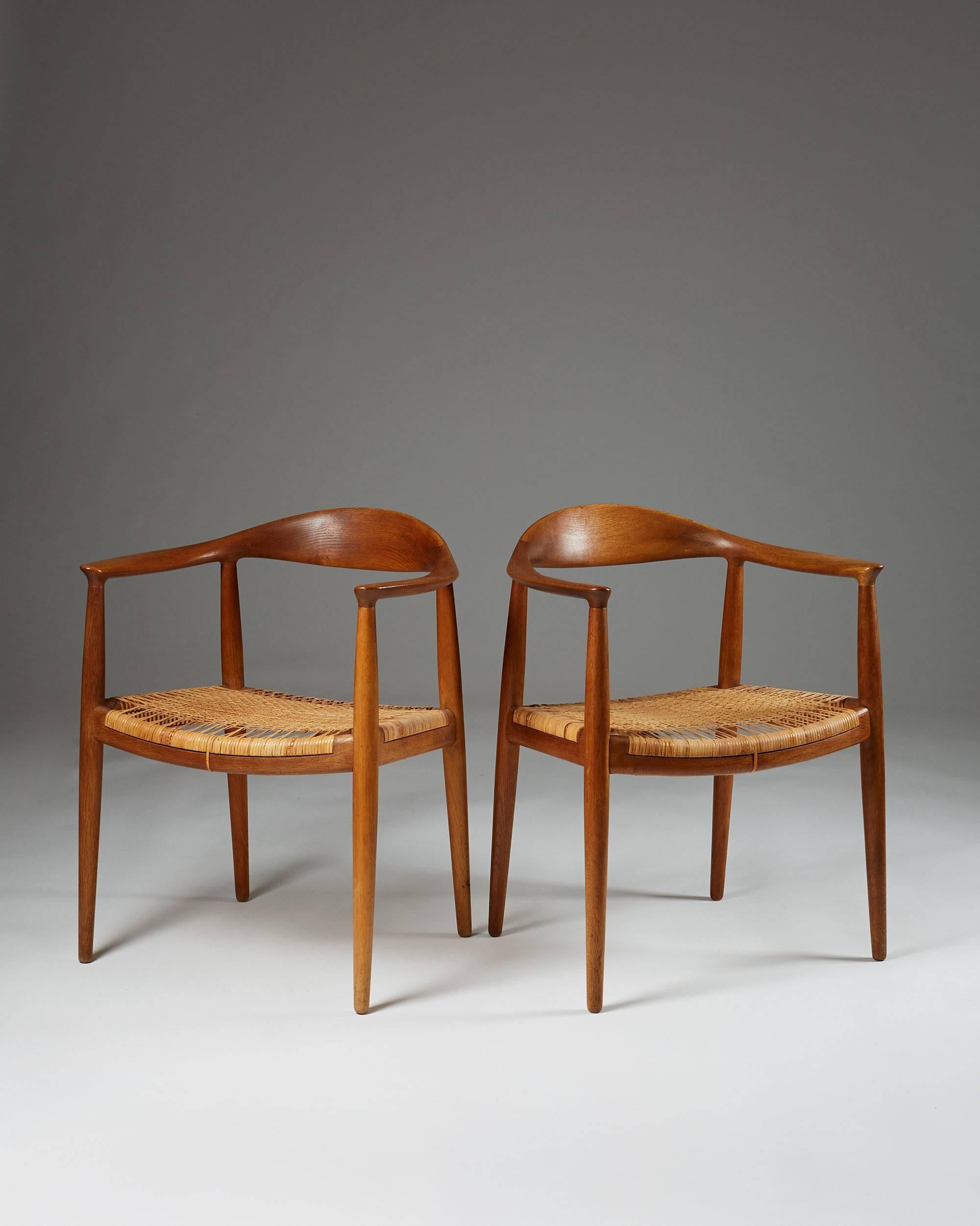 Pair of armchairs “The Chair” designed by Hans J. Wegner for Johannes Hansen, Denmark. 1949. Teak and cane.

Measures: H: 76 cm/ 30