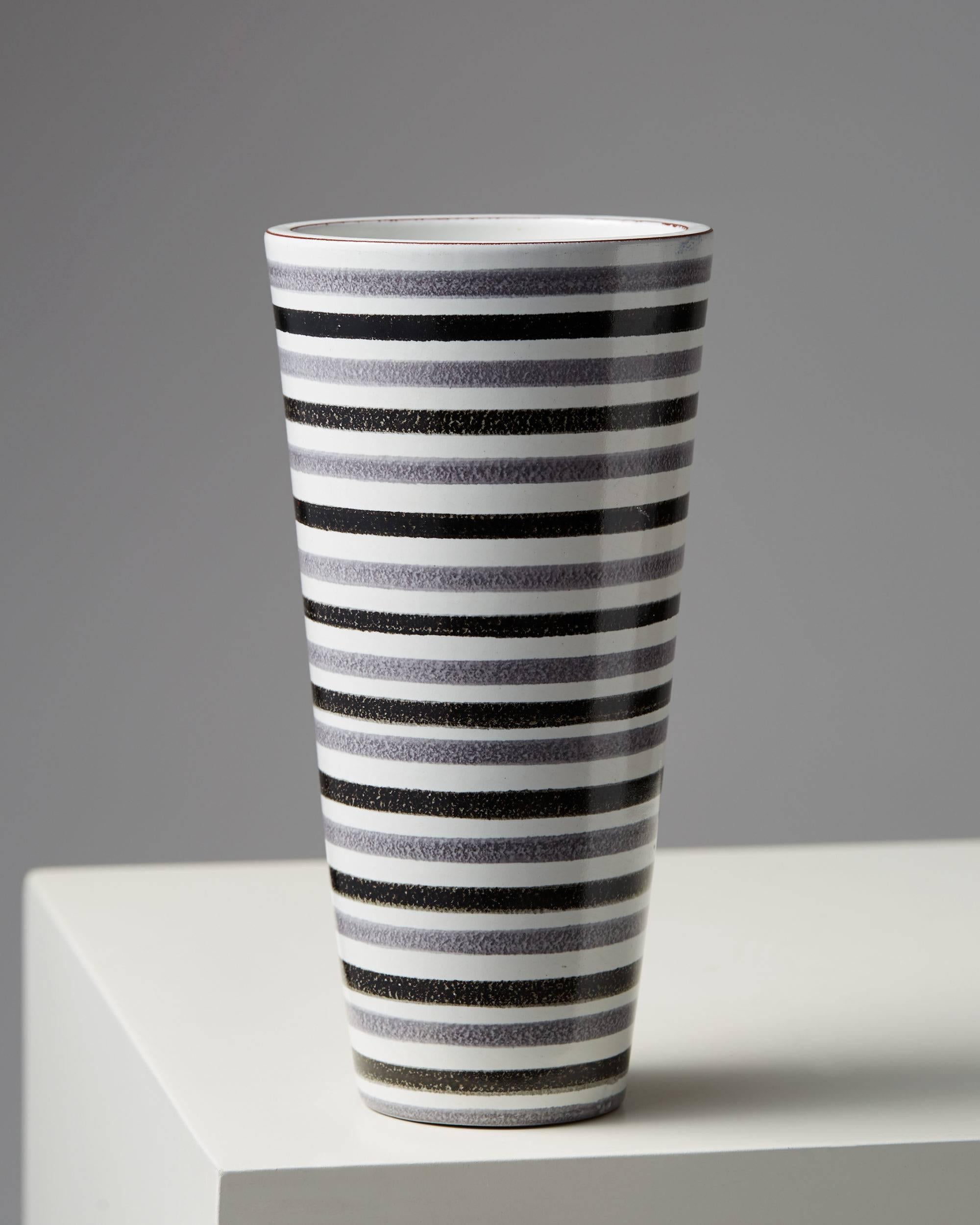 Vase designed by Stig Lindberg for Gustavsberg, Sweden. 1950s.

Measures: H: 21.5 cm/ 8 1/2''.
