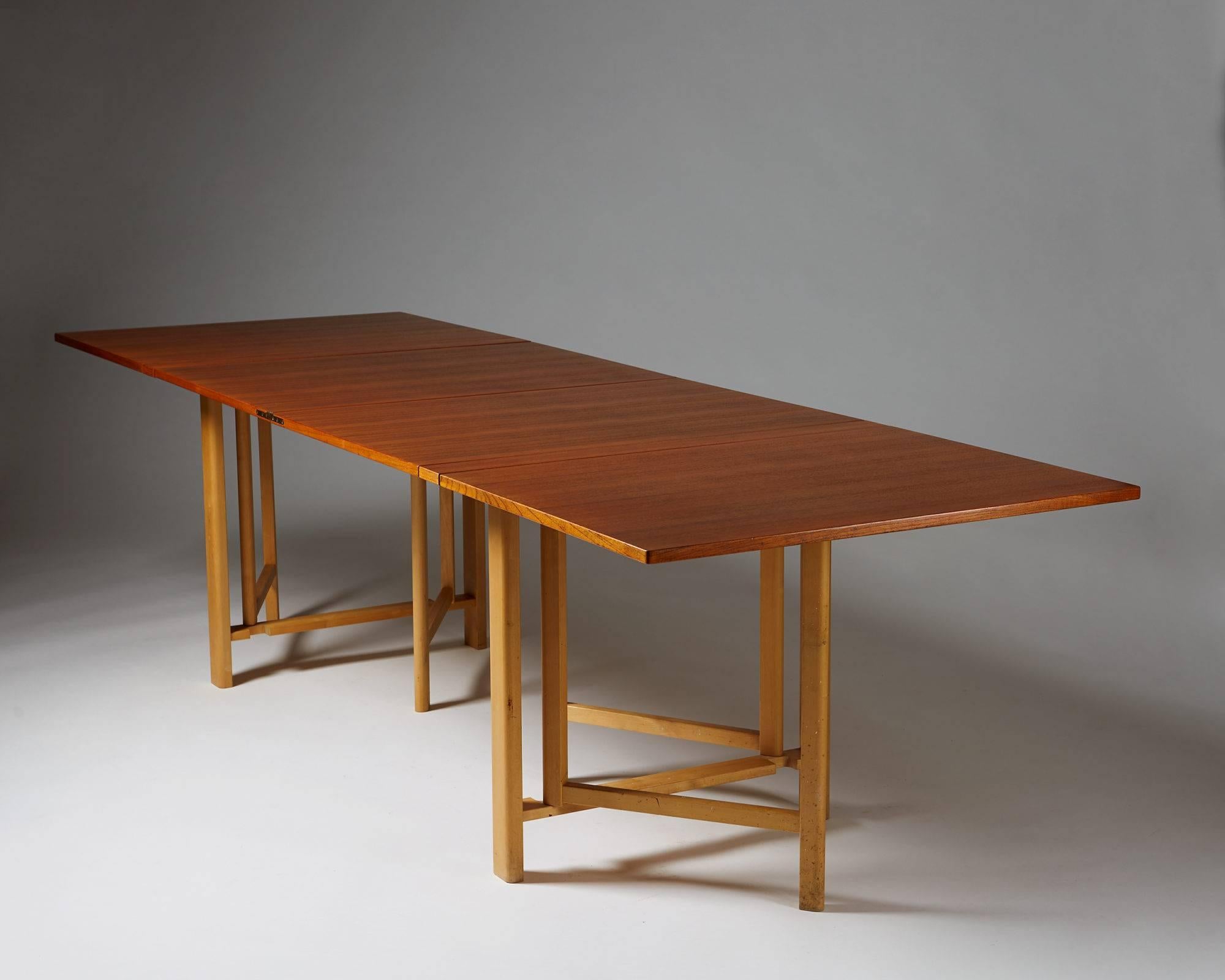 Dining table “Maria Flap” designed by Bruno Mathsson for Mathsson International, Sweden, 1965.
Teak top with beech legs.

Measure: H 72 cm/ 2' 4 1/2''
W 90 cm/ 3'
L 23 to 278 cm/ 9'' to 9' 2''.