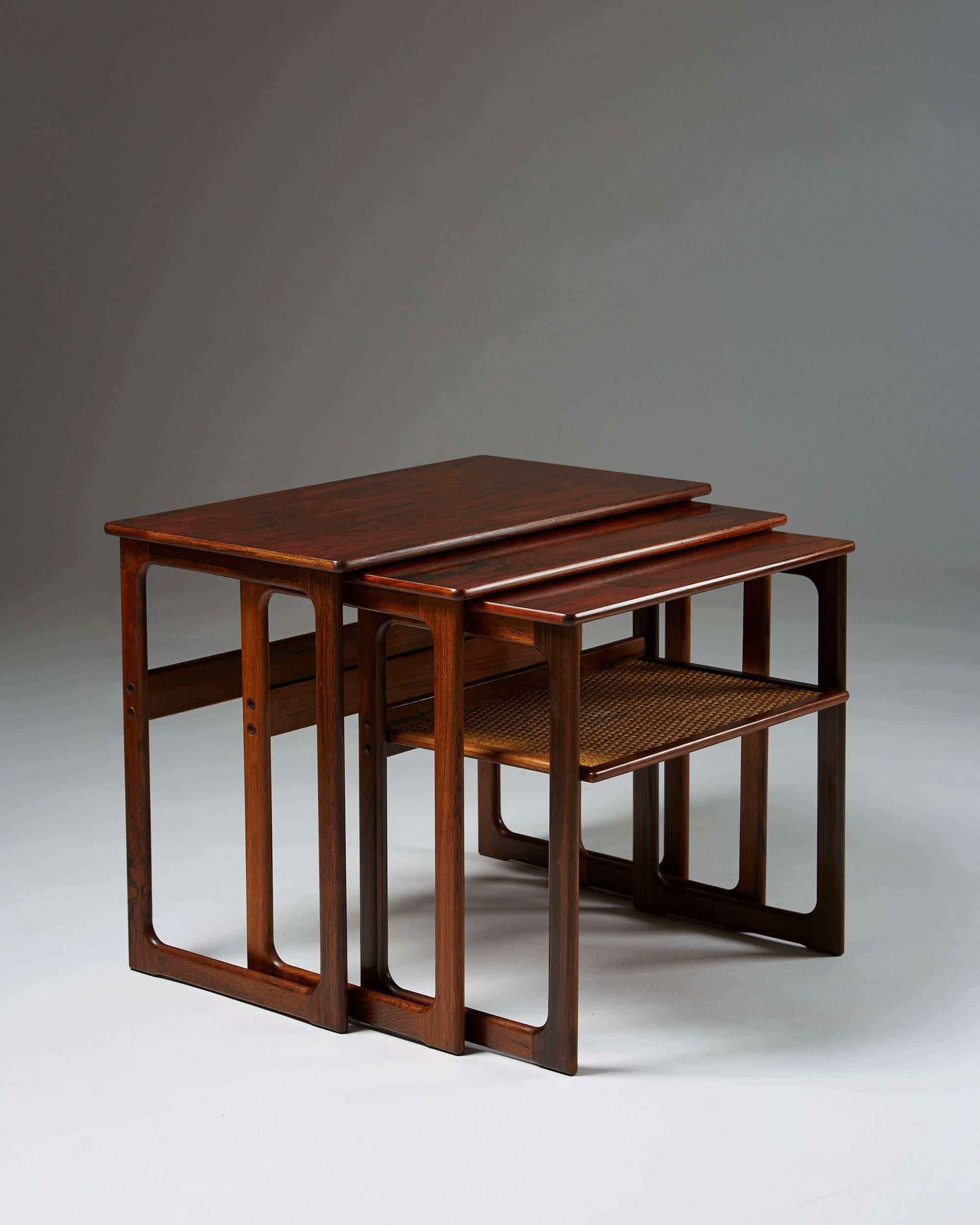 Nest of tables designed by Johannes Andersen for CFC Silkeborg, Denmark, 1960s.
Rosewood and cane.

Measures: H 53 cm/ 20 3/4