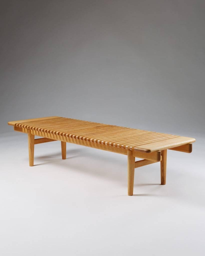 Bench designed by Hans J. Wegner for Johannes Hansen,
Denmark, 1953.

Solid ash.

Measures: H 35 cm/ 13 3/4