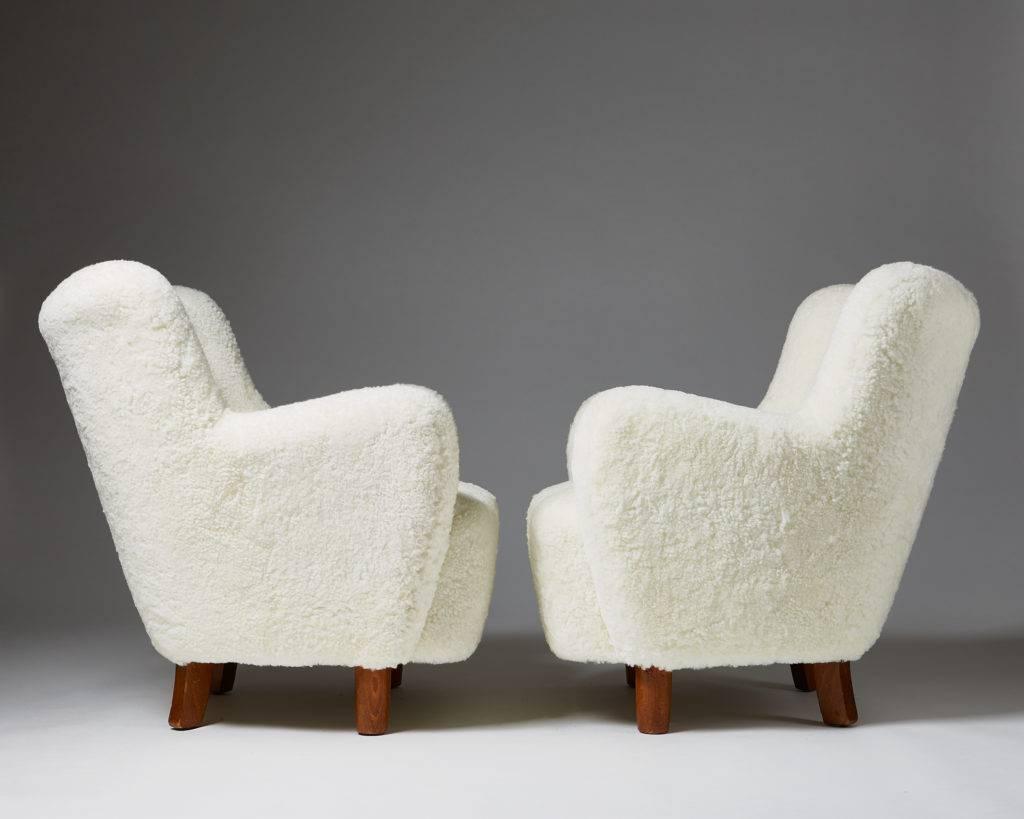 Danish Pair of white sheep skin armchairs, Anonymous, Denmark, 1940s