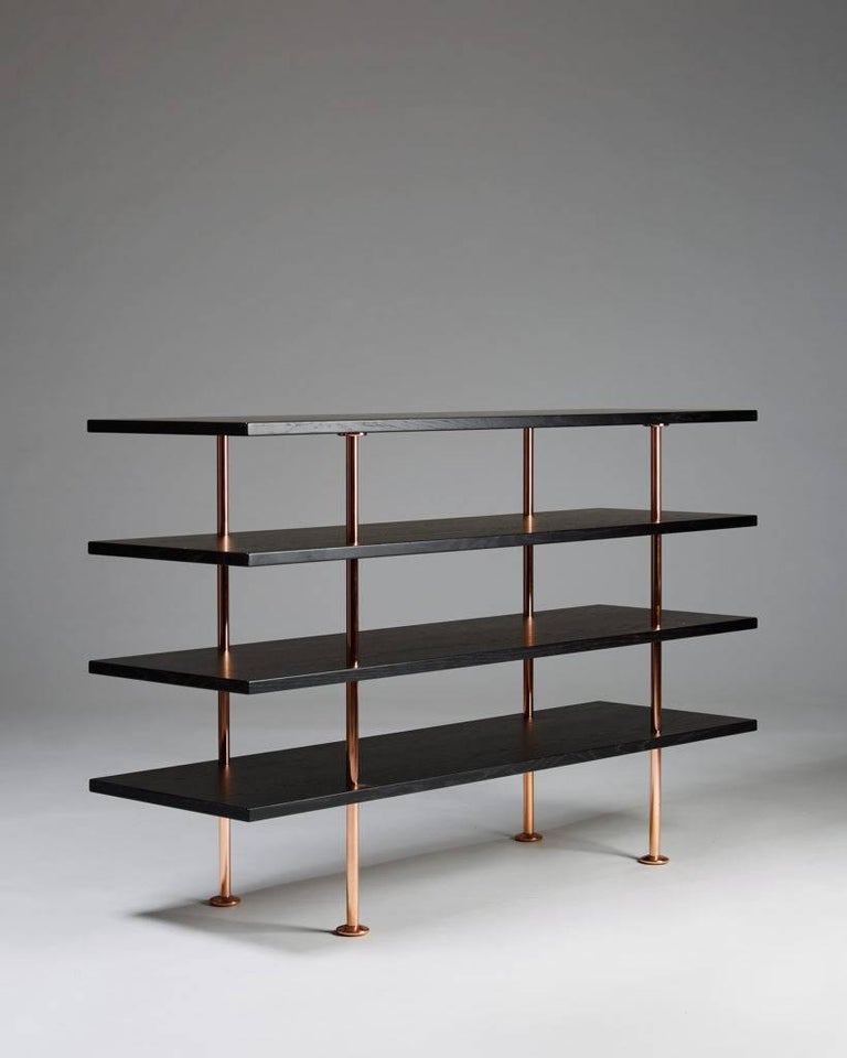 Shelving system designed by Bruno Mathsson,
Sweden, 2015.

Lacquered wood and copper.