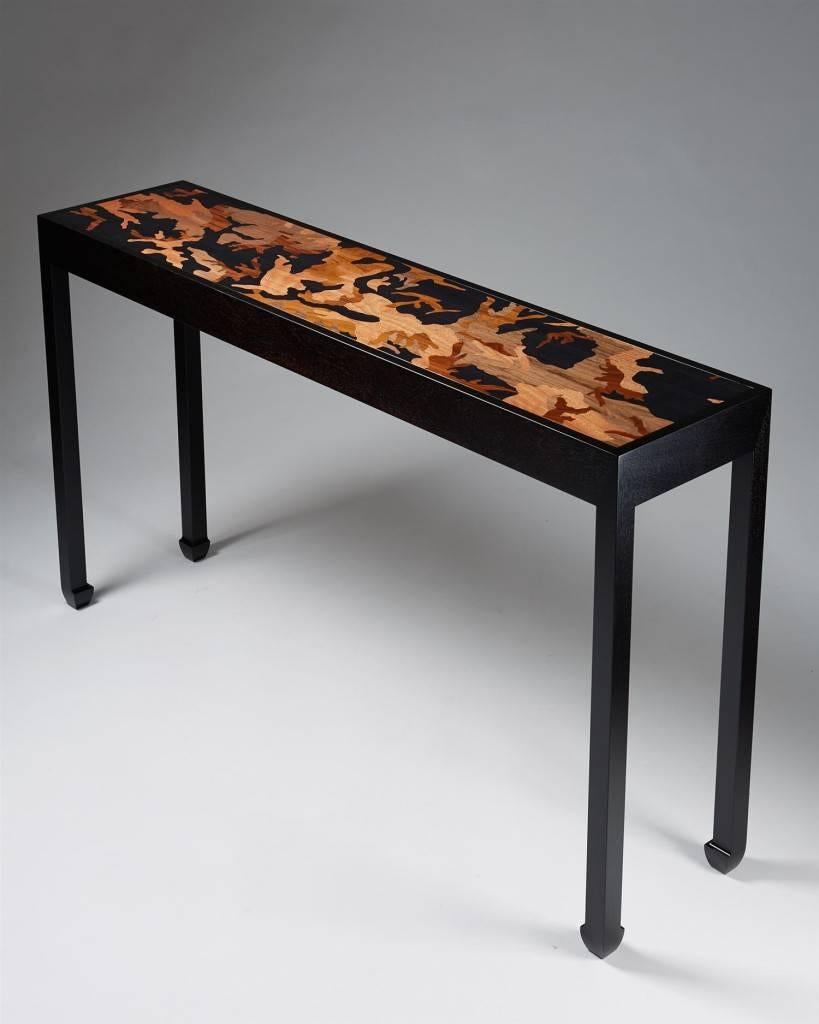 Console table designed by Morten Höeg Larsen, 
Denmark, 2015.

Ebonized wood and various wood inlays.

One of a pair.