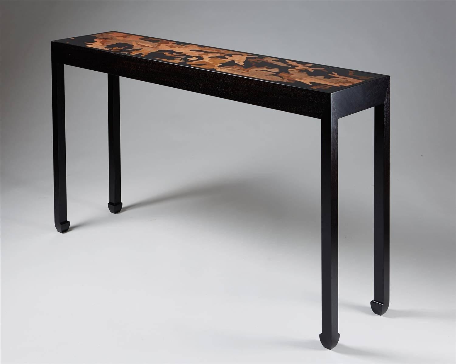 Console table designed by Morten Höeg Larsen, 
Denmark, 2015.

Ebonized wood and various wood inlays.

One of a pair.