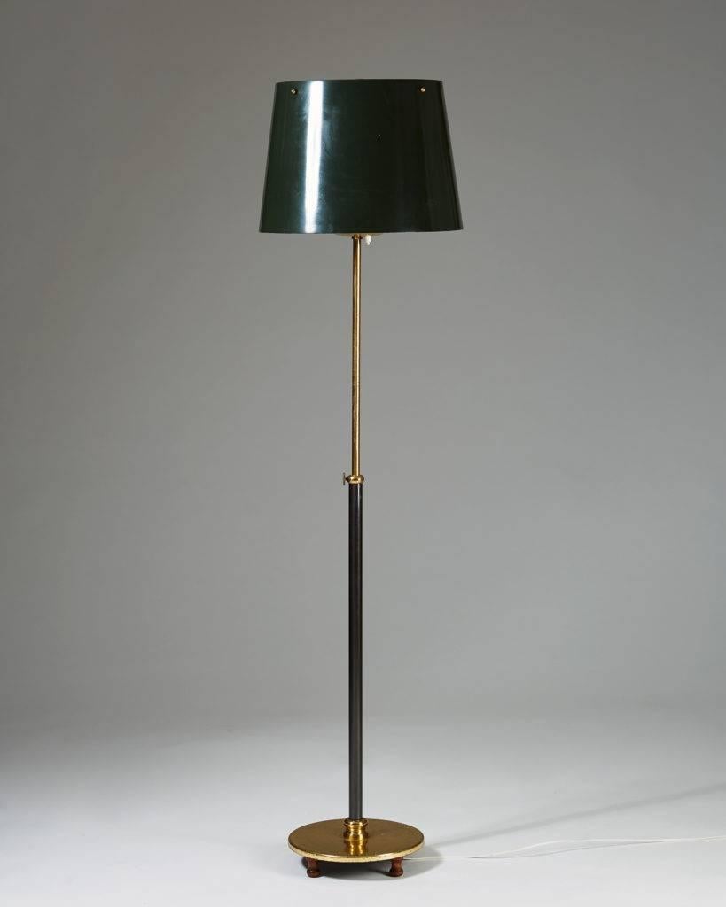 Floor lamp designed by Josef Frank for Svenskt Tenn, 
Sweden, 1950s.

Polished and lacquered brass, with green lacquered shade.

Measures: H 160 cm/ 5' 3 3/8