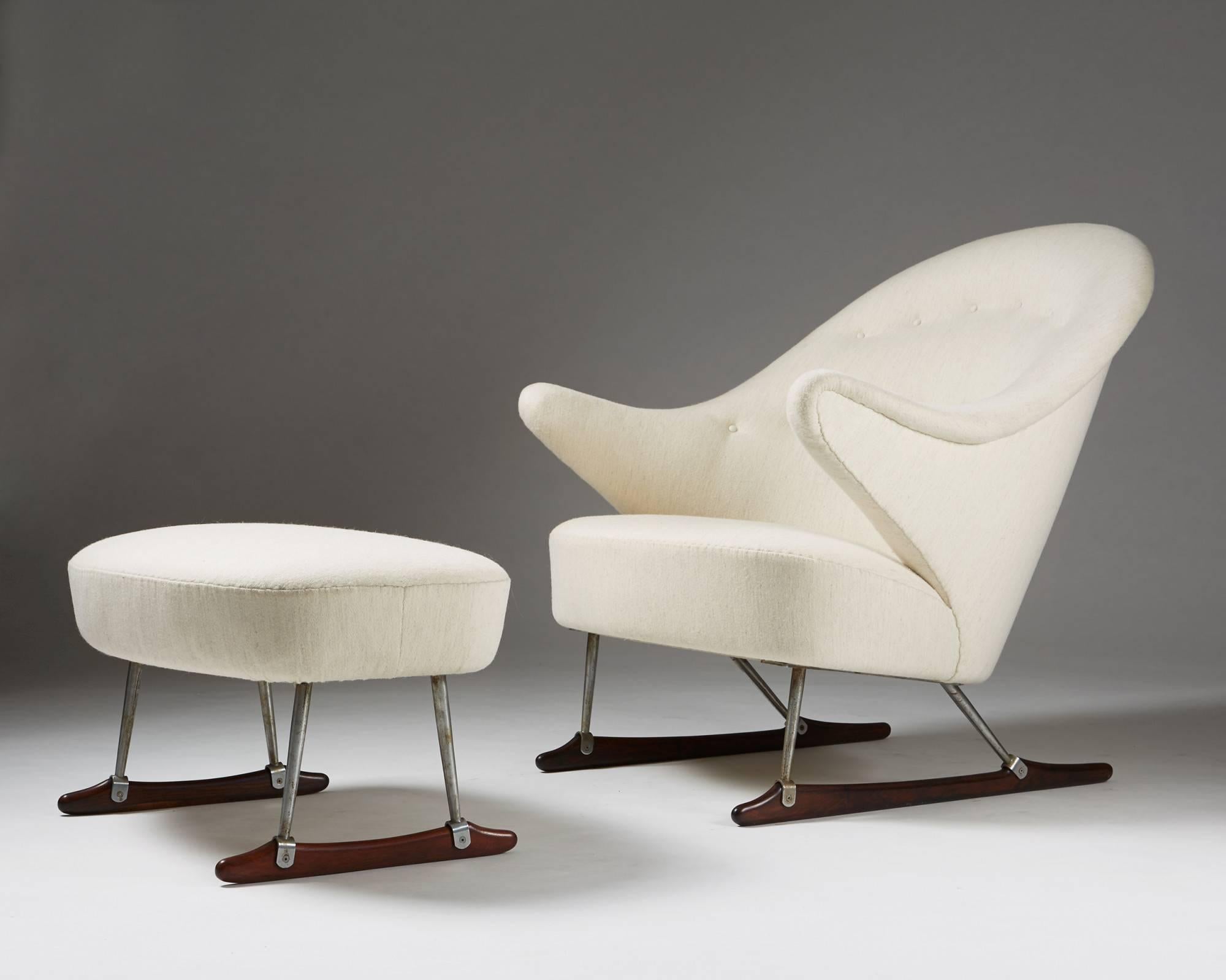 Sleigh chair designed by Börge Mogensen for Tage M Christensen & Co,
Denmark. 1953.

Wool upholstery, steel legs and Brazilian rosewood runners.

Armchair:
H: 82 cm/ 2' 8 1/8