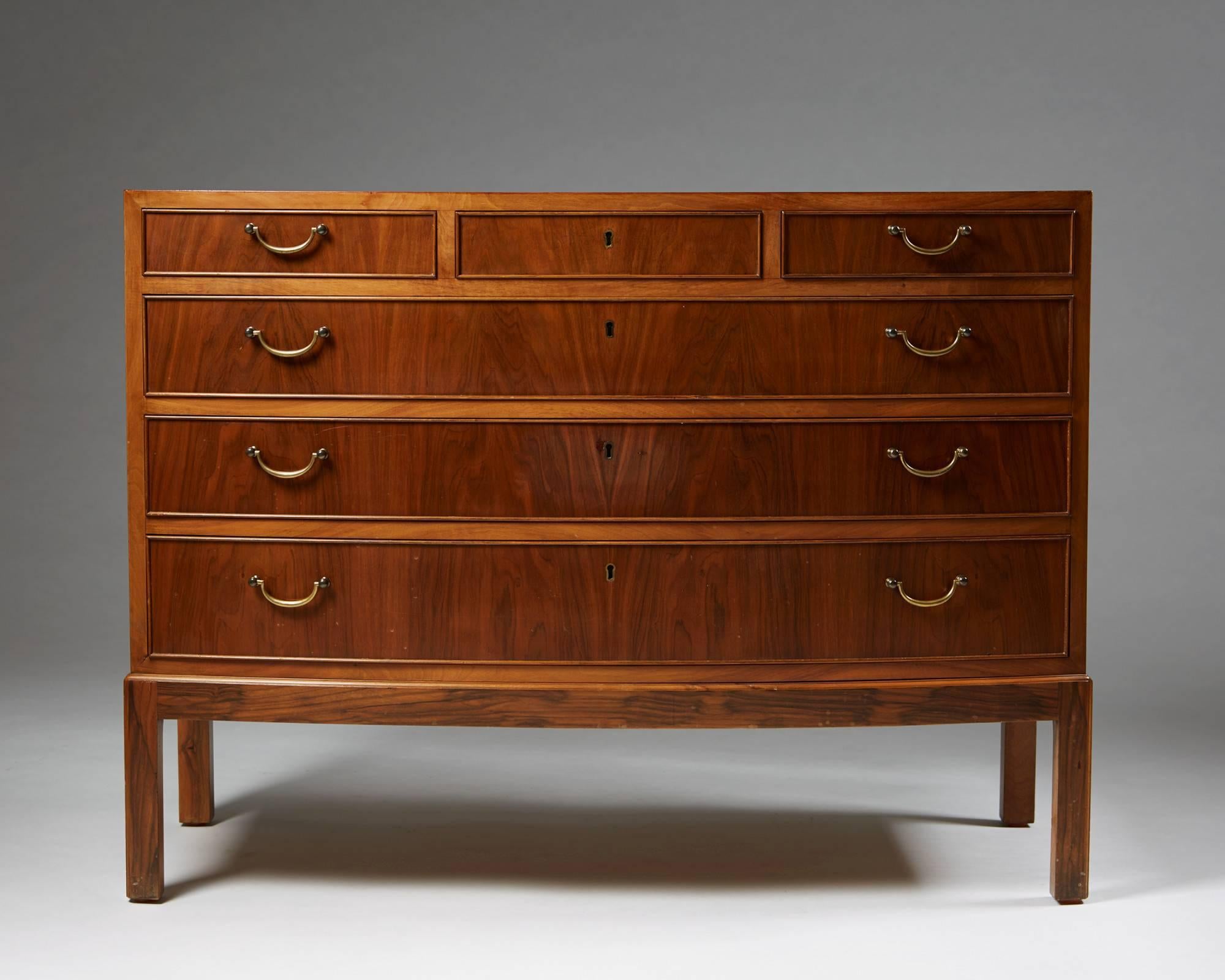 Chest of drawers designed by Ole Wanscher for Illums Bolighus, Denmark, 1940s.
Walnut and brass.

H 78 cm/ 30 3/4".
L 106 cm/ 3' 5 1/2".
D 49 cm/ 19 1/4".
