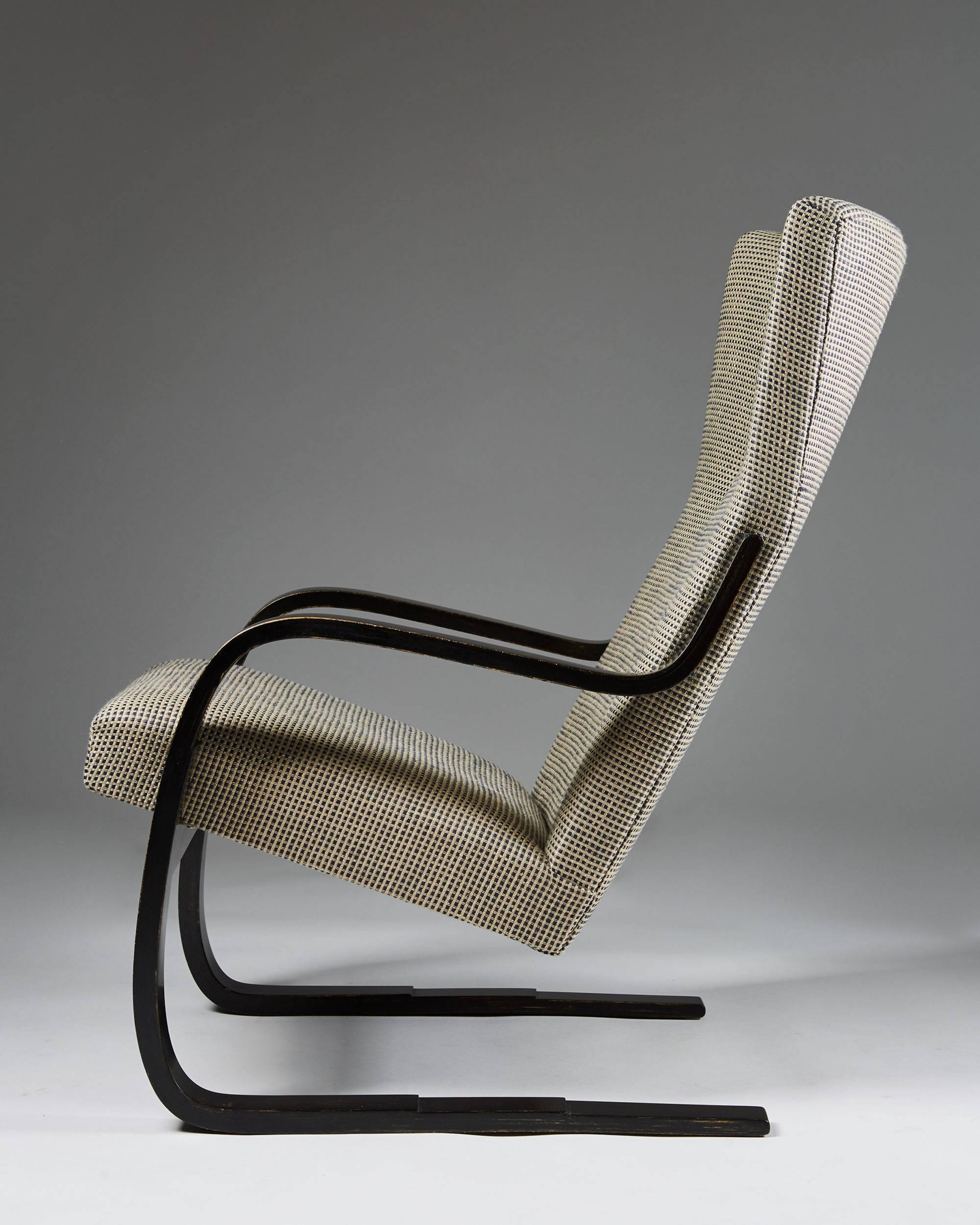 Armchair designed by Alvar Aalto for Huonekalu-Ja Rakennustyötehdas Oy, 
Finland, 1932-1933.

Lacquered beech, cotton and lined upholstery.

Measures: H: 94 cm/ 37''
W: 62 cm/ 24 1/2''
D: 85 cm/ 33 1/2''
Seat height: 44 cm/ 17