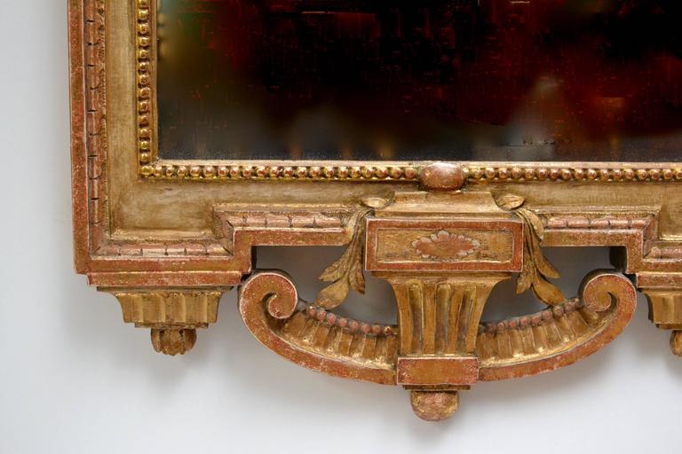 A very fine Gustavian carved giltwood mirror signed by Johan Åkerblad (1728-1799). The gilding and the glass is original. Åkerblad was one of the leading craftsmen of his time delivering to the royal castles and other prominent buyers.