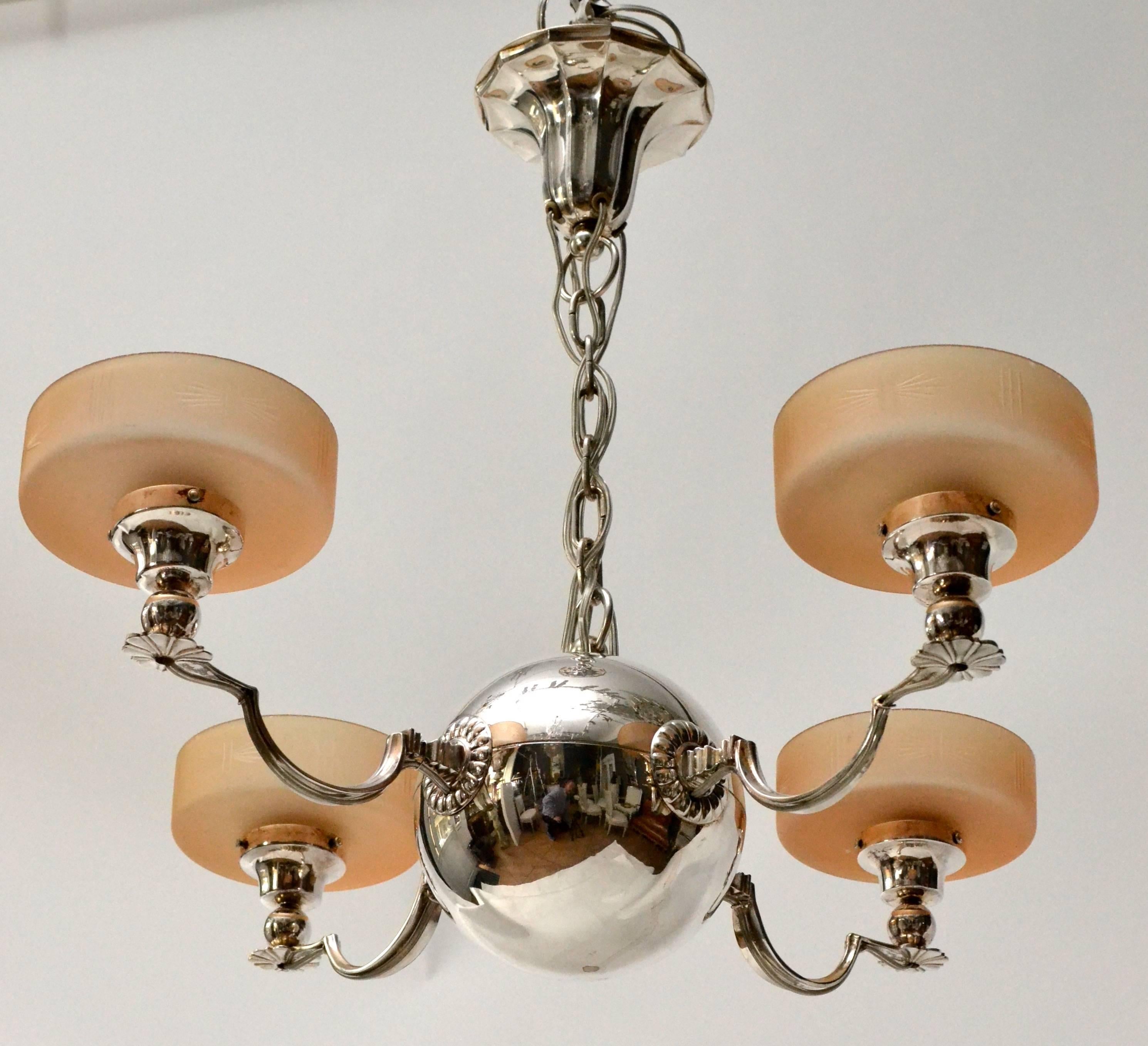 An Art Deco silver plated ceiling lamp after a design by Elis Bergh and made by CG Hallberg, circa 1925. Lampshades of glass.
 