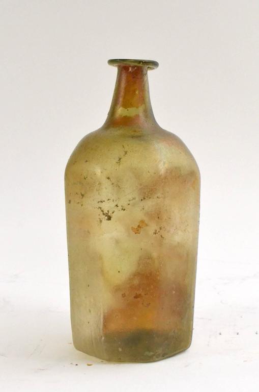 A Roman glass bottle first-third century AD.
