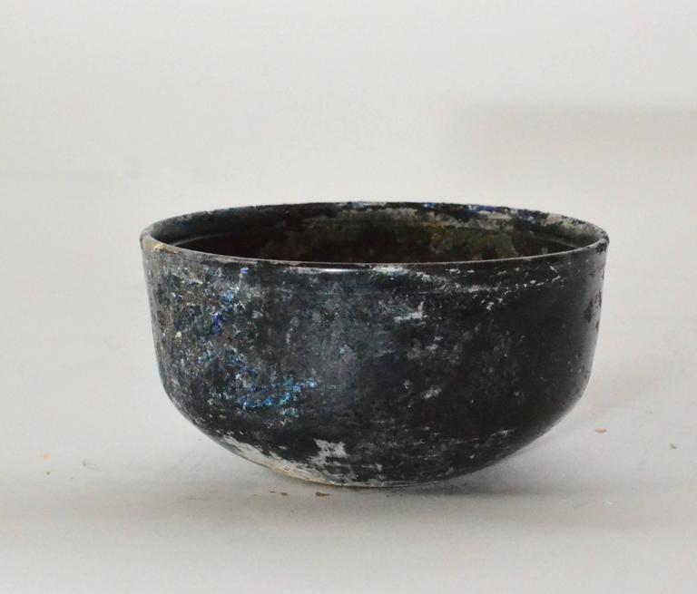 A Roman iridescent glass bowl first-third century AD.