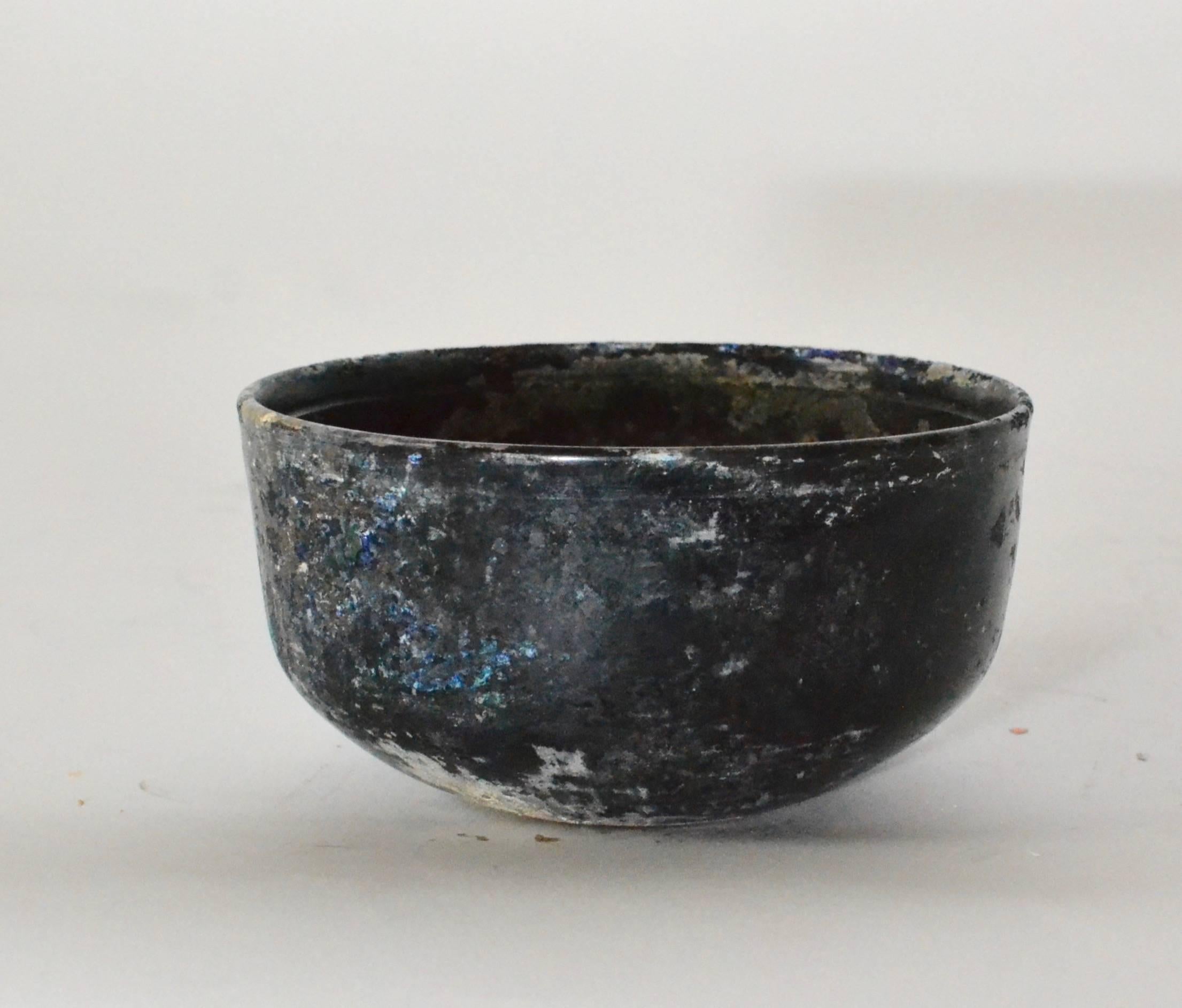 A Roman iridescent glass bowl first-third century AD.