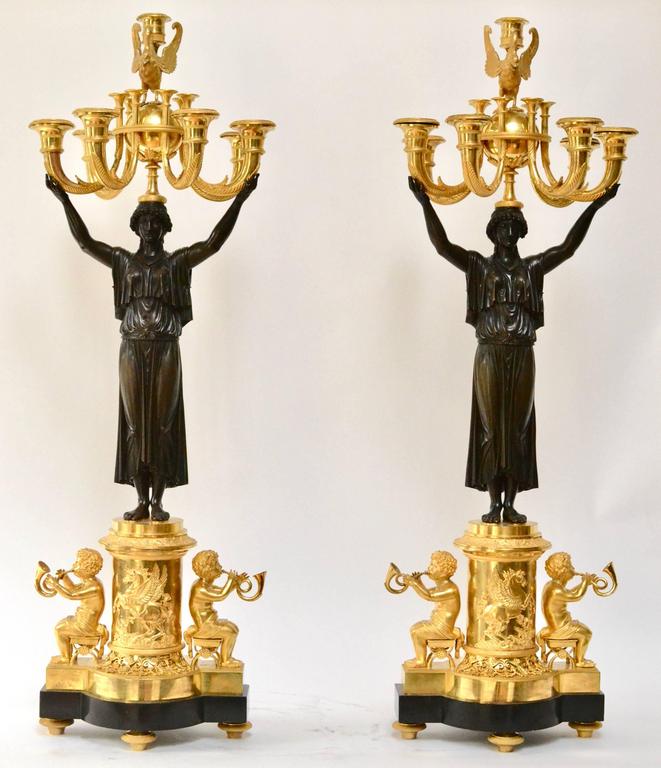 A pair of important gilt bronze empire candelabra made in Paris, circa 1805. 
Bibliography:
Connaissance des Arts 08 1959 collection Fabius.
An almost identical pair sold at the Groussay Sale 2/6 1999 Sotheby's Paris.
Another pair was in The