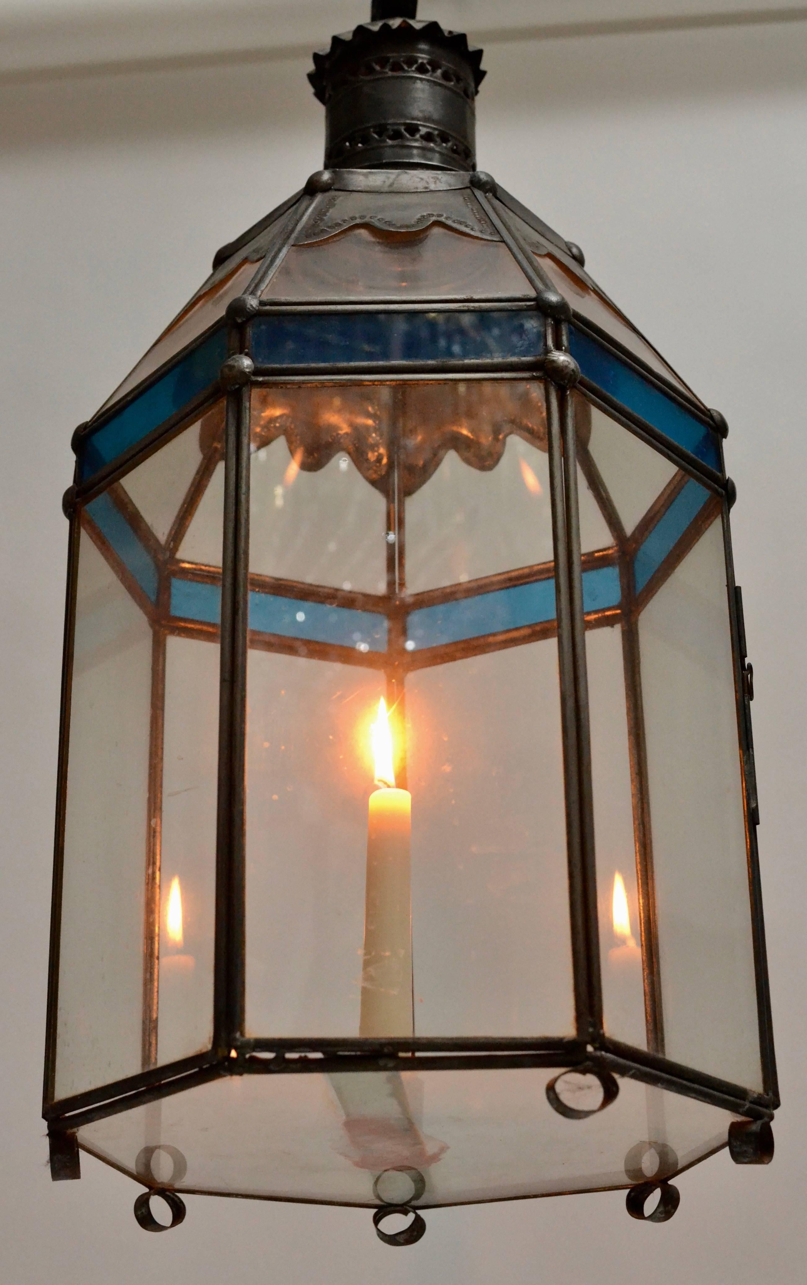 A Swedish tinplate lantern with blue and clear glass, 19th century.