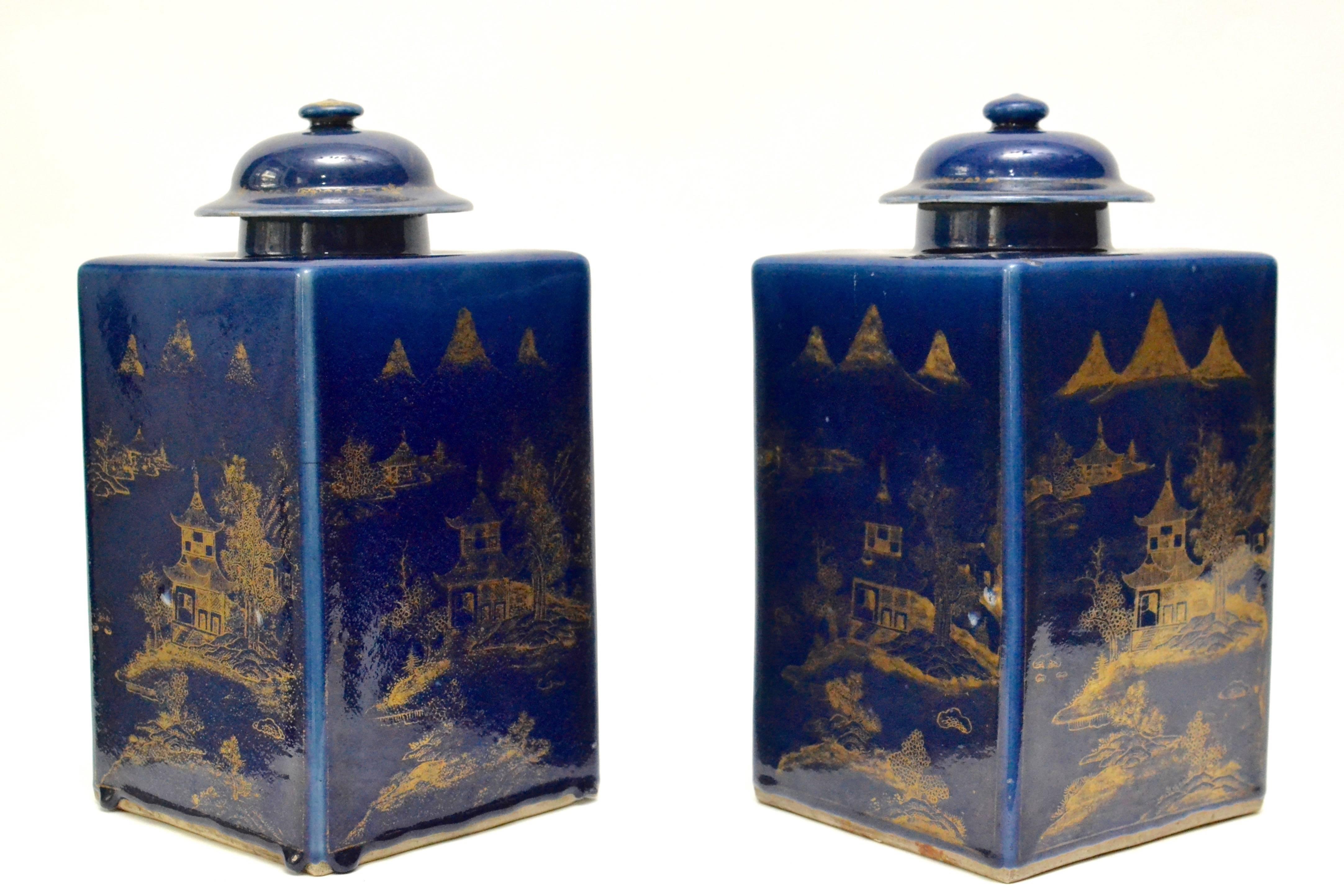 A rare pair of late 18th century or early 19th century Chinese powder blue tea caddy urns with lids.