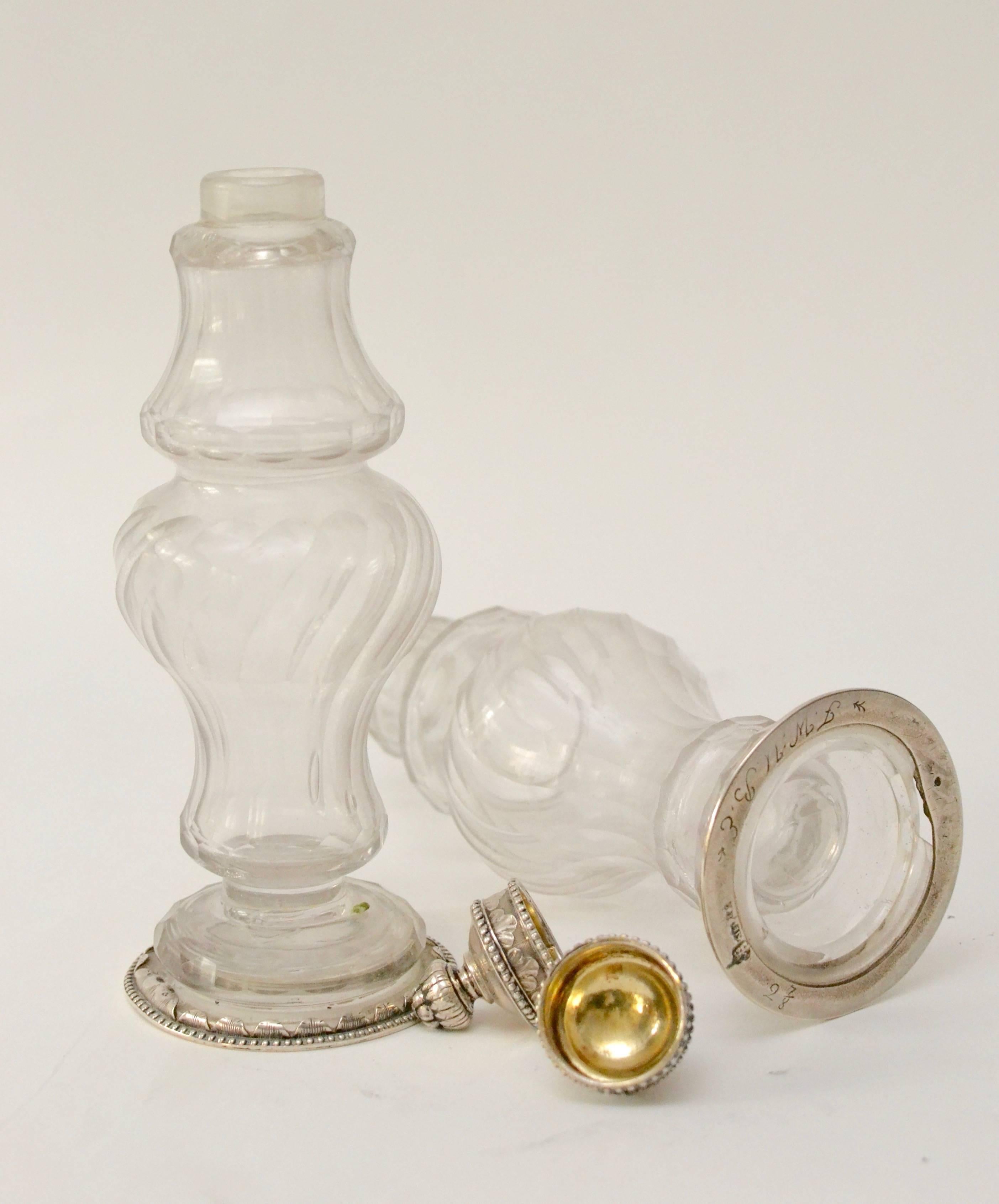 A pair of Swedish, 18th century silver-mounted cut-glass vinegar and oil bottles by Andreas Isberg, 1790. Signed.