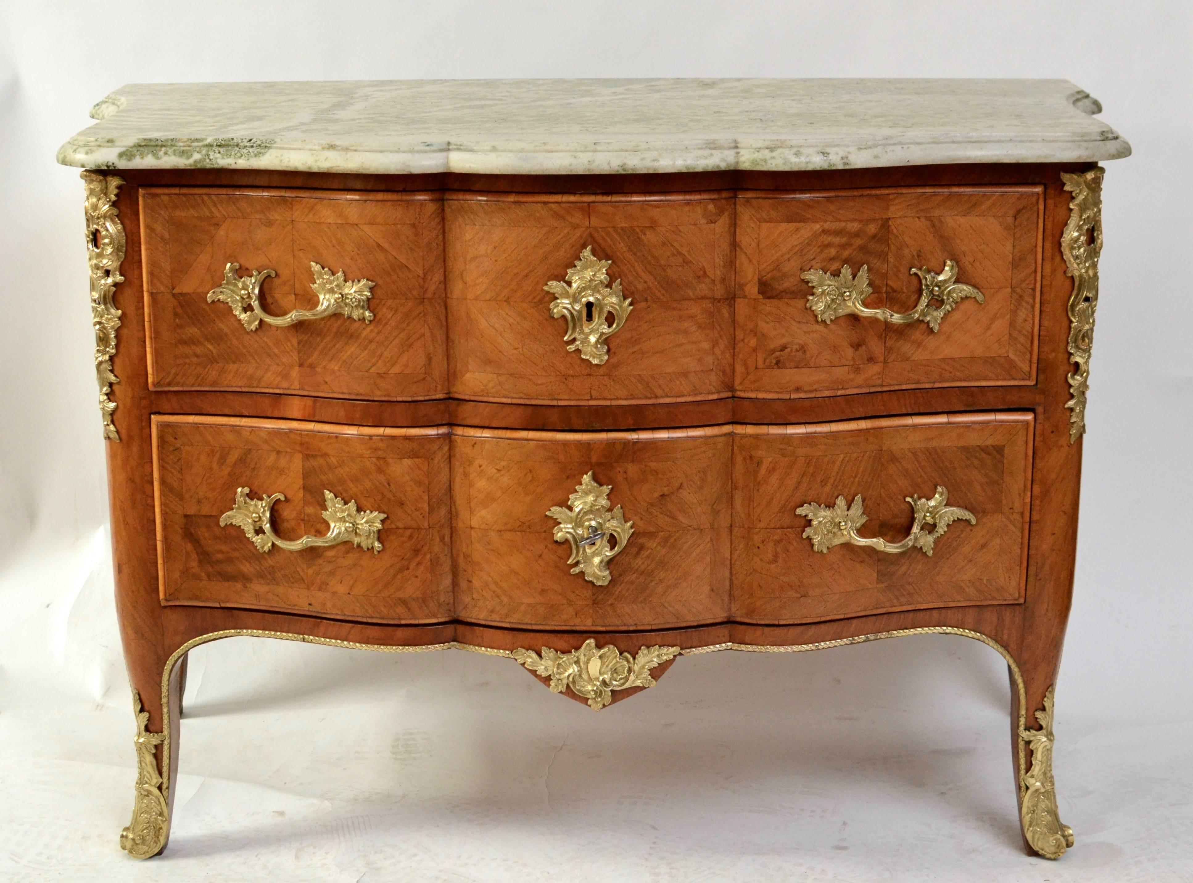 A very fine and important Swedish Rococo ¨commode en console¨by Olof Martin, master in Stockholm 1736-1764. Veneered with walnut and with it´s original Swedish marble top. The commode is in a very nice original condition.
Provenance: 
Hersby Gård,