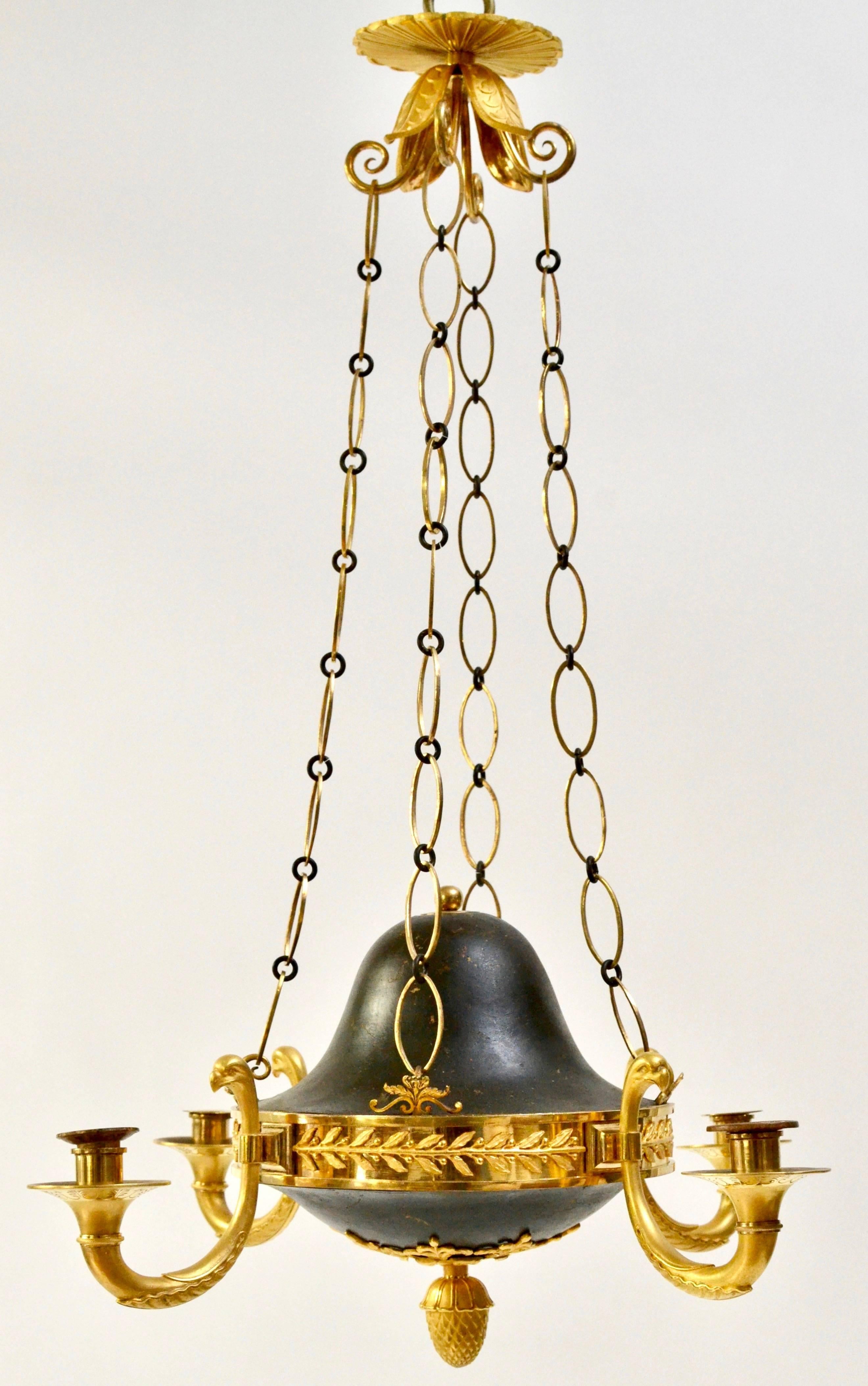 A fine and rare Russian gilt and patinated bronze chandelier from the Empire period, St Petersburg, circa 1810.