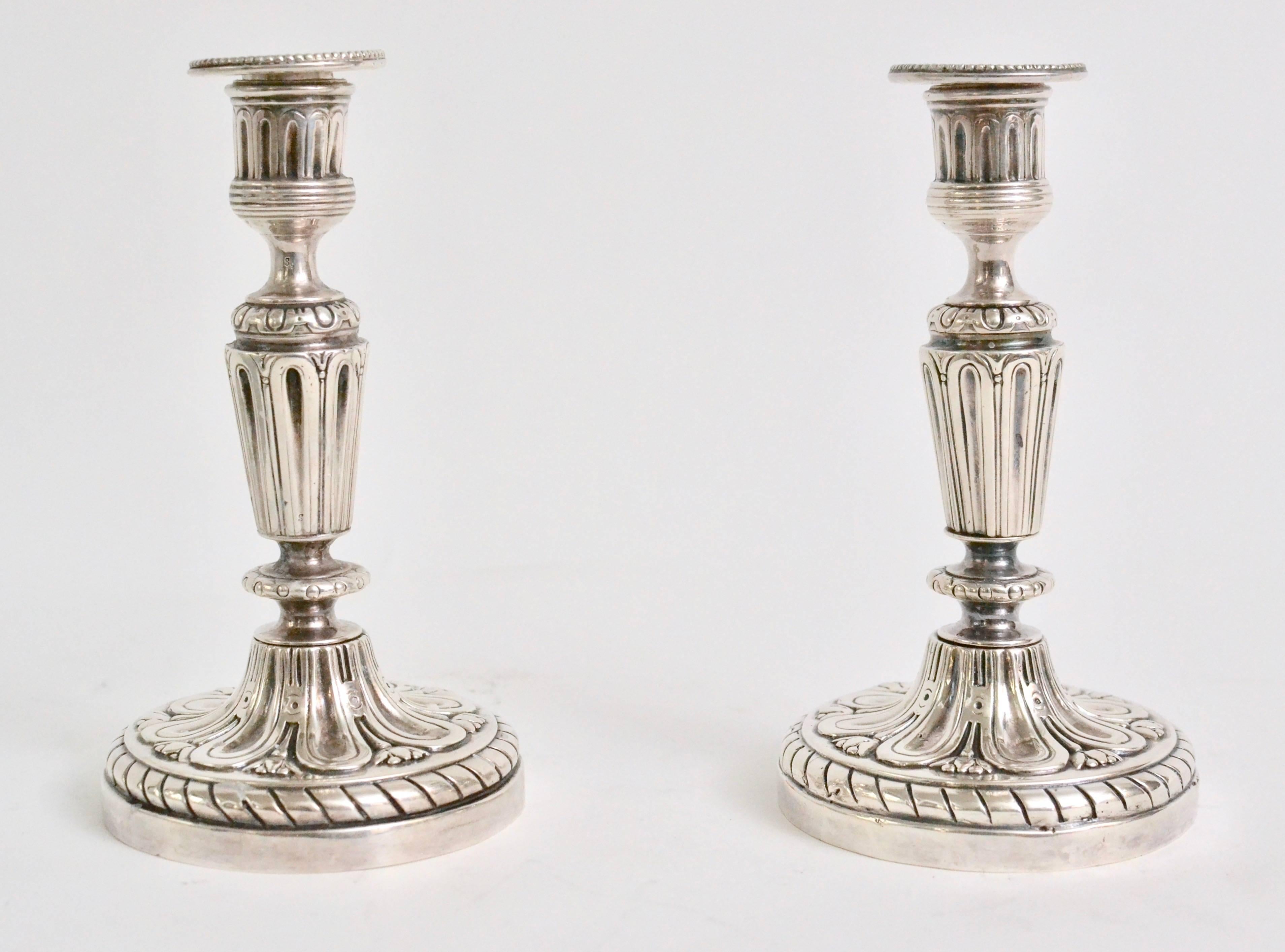 A fine pair of silver-plated bronze Louis XVI candlesticks. 18th century. During the 18th century and very early 19th century the silver plating technique was called argent haché which means hacked silver. Later in the 19th century the