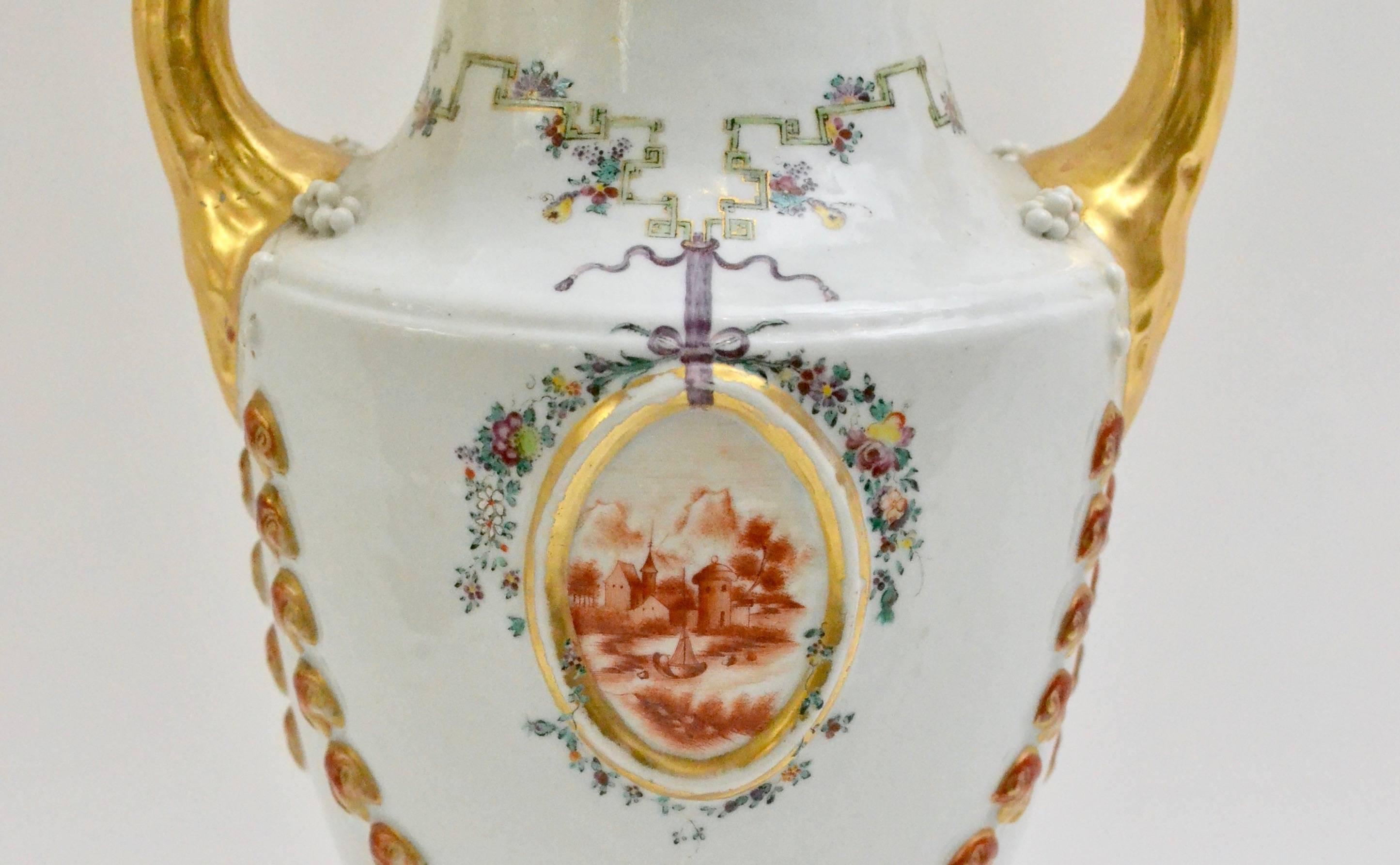 A Chinese export porcelain pistol-handled famille rose urn, Jiaqing period, circa 1800. After the Marieberg type model.
      
    