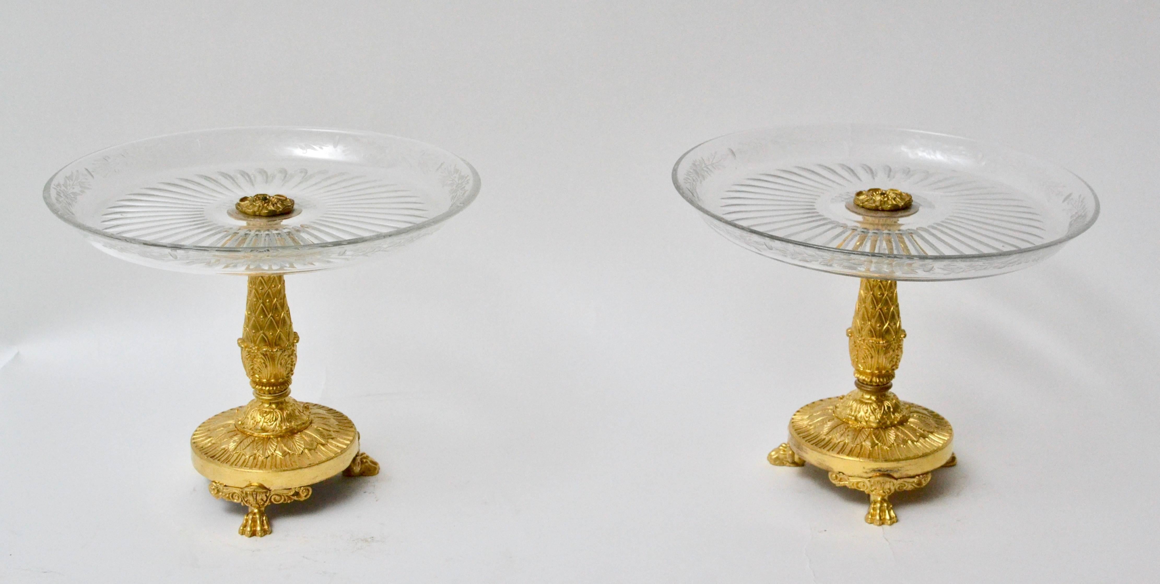 A pair of Empire gilt bronze and cut-glass Empire tazzas, surtout de table.