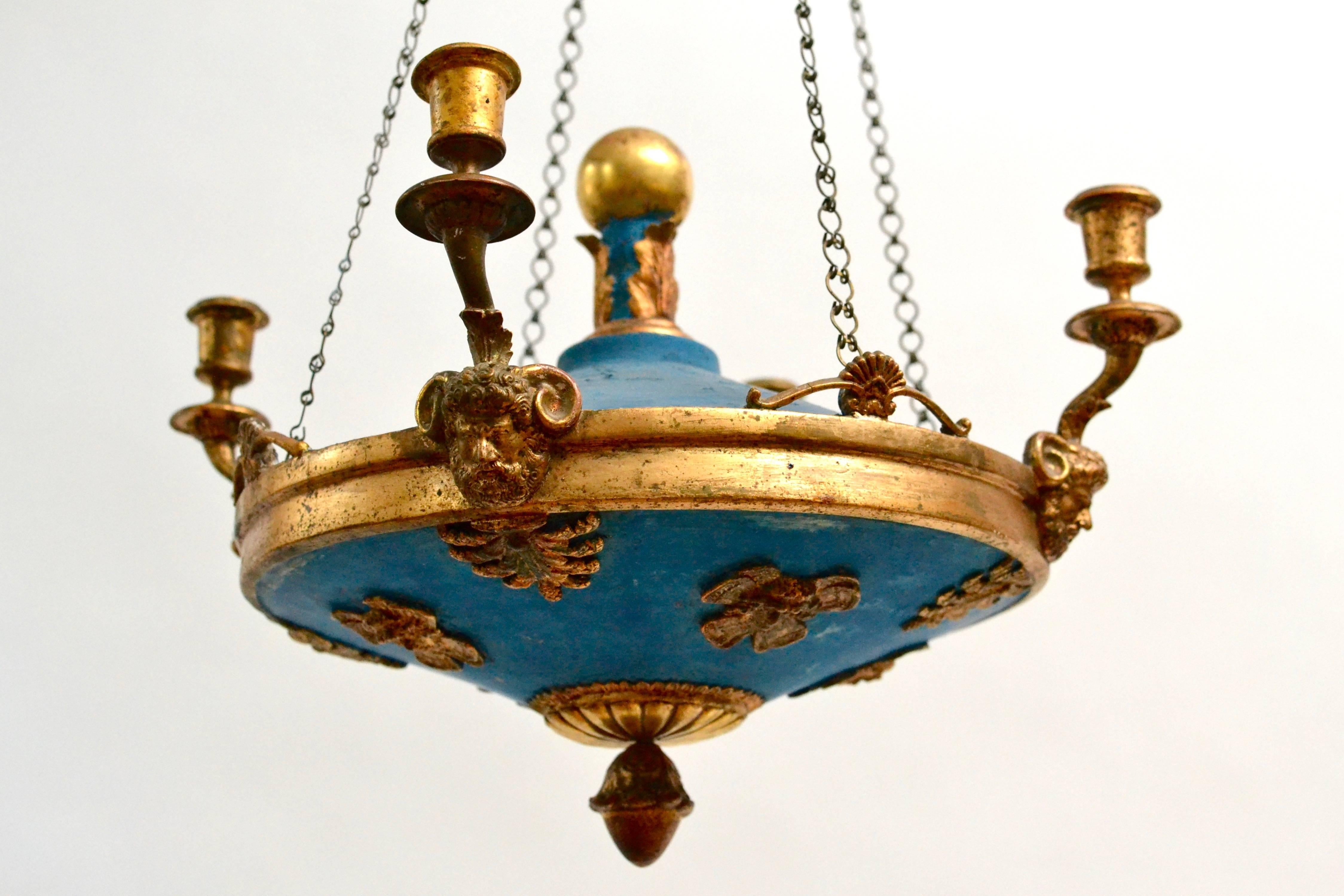 A painted and giltwood Empire chandelier. Probably Baltic, circa 1820-1830.